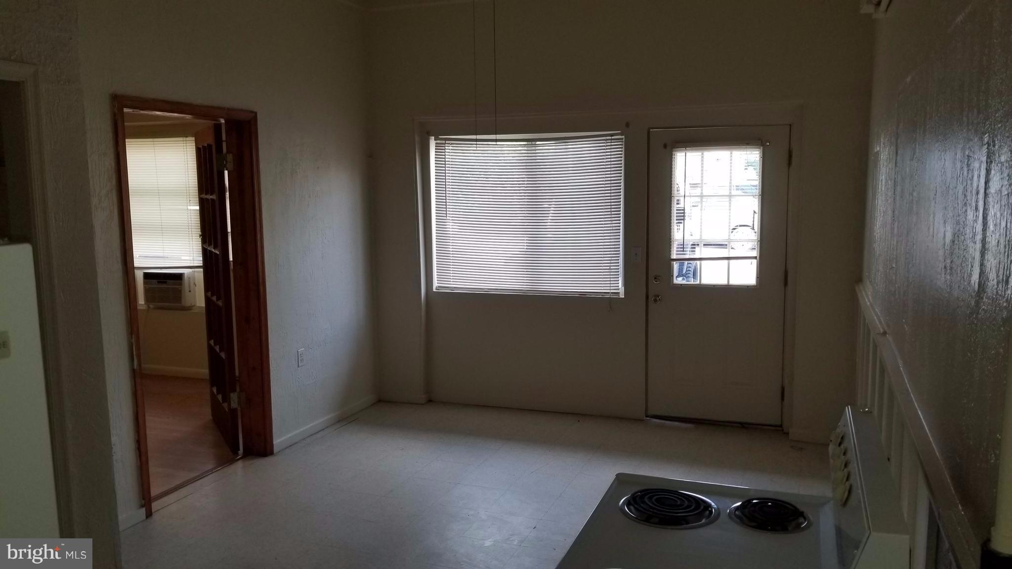 Ground floor rental apartment in downtown Berkeley Springs. Rent covers water, sewer, trash, and TV. No smoking, no pets, federal fair housing rules apply. 2 bedrooms and 1.5 baths. Includes fridge, range, and airconditioner.