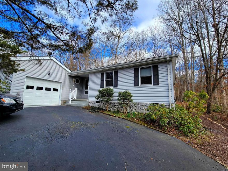 Welcome to the Lake! This comfortable 3 bed, 2 bath home with paved circular driveway is tucked away in this beautiful gated community with access to the Main Lake just a short walk away. Enjoy the private back yard with beautiful mature trees and wonderful views. Come put your finishing touches on this lovely home and start living the Lake Life today!!
Home boast a cozy sunroom off of the primary bedroom, great deck off the Den, a nice sized dining room and attached 1 car garage make this home a must see! This home is perfect for a family or if you are looking to relax and find your retirement home, this is it!! Easy 1-level living and low maintenace yard! Schedule your showing today. Don't wait!!