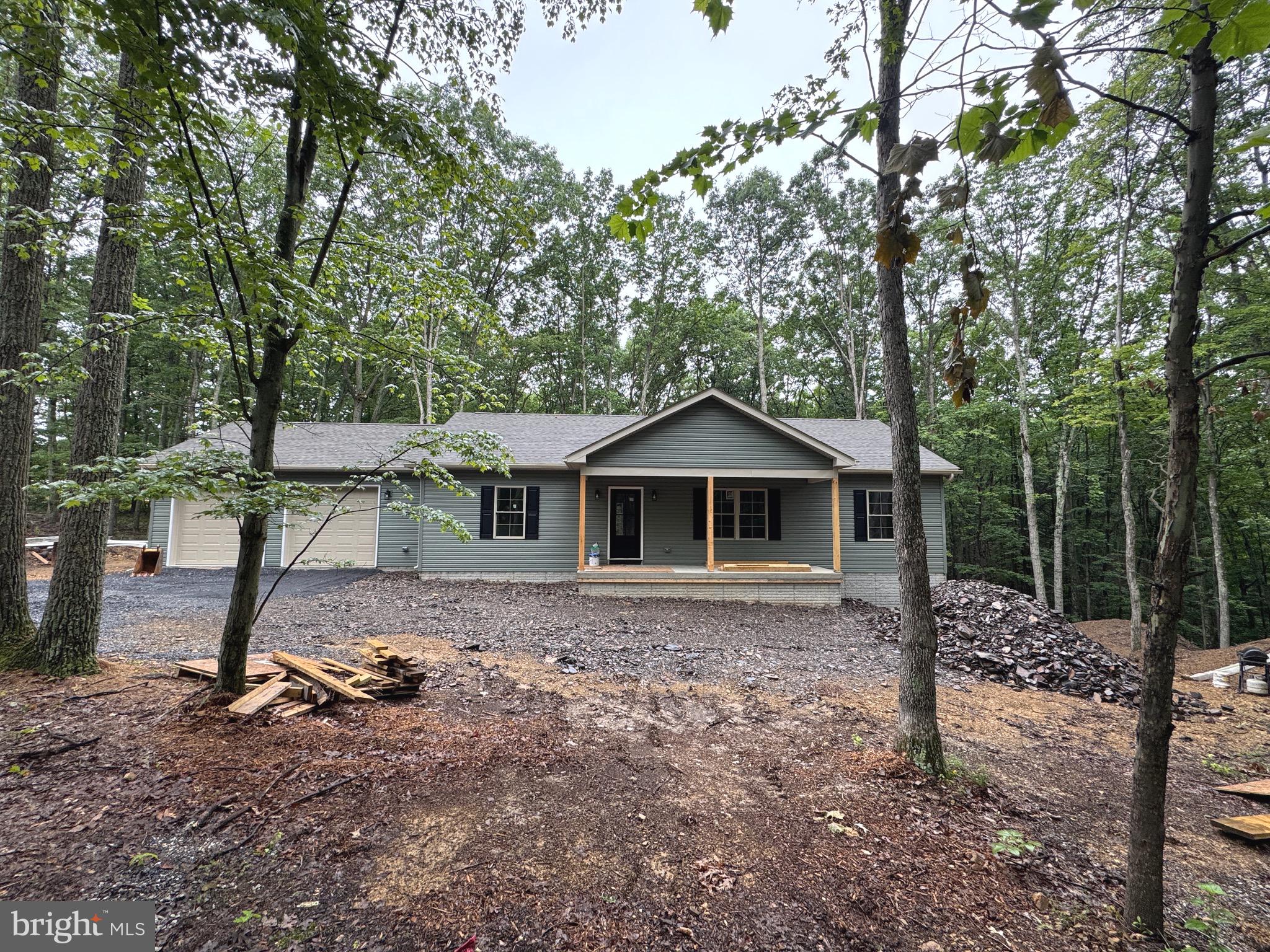 It's time to get this New Build under contract.....Home is on Black Top Road Just a short distance off Northwestern Pike, (WV Rt 50) This 3 bedroom, 2 bath, 2 car garage is waiting for you to call it home. Situated among the trees gives the feeling of country living yet easy access to VA work force. The home sets on a full walkout basement that will you many possibilities to make it fit your needs. (Profession pictures & virtual tour will be added soon)
