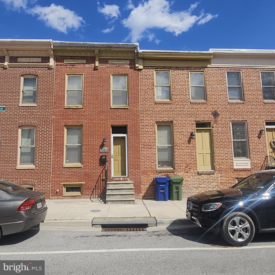 A double wide two story all brick town home is waiting for you.  A modern approach to urban living. Just a walk from Johns Hopkins Hospital.. become a  new neighbor in  this emerging community. Minutes from main highways  and Fells Point water front. this home needs some TLC but please give her a second thought. This is a one of a kind opportunity with a one of a kind floor plan. The home has a powerful flow. The 2nd floor has generous bedrooms  as well as a reading foyer. Carpet on 2nd floor but Hardwood abounds on main level . Basement is unfinished , but dry and large enough to restore and finish. Recessed lighting and ceiling fans are used . This property also has a sprinkler system. The kitchen is open and airy . It leads to a sweeping rear deck and enclosed rear yard. Seller is motivated to sell and will make no repairs. Conventional,203(k),Cash financing suggested. Home Inspection is for Buyer's Informational purposes ONLY. Two year  home warranty included