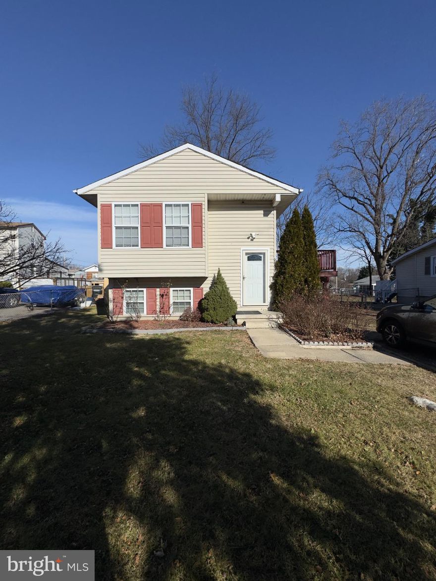 This spacious and affordable home offers an incredibly low cost of living. This home features solar panels that help keep electric bills near zero, plus an impressively low water bill (usually under $50 every 6 months). The upper level includes 3 bedrooms and 1 full bath, while the lower level offers an additional bedroom, full bath, and a convenient kitchenette, ideal for guests or extra living space. Enjoy outdoor living with a deck and large backyard, and benefit from NO HOA and county trash pickup. Conveniently located near major commuter routes, shopping, and everyday essentials.