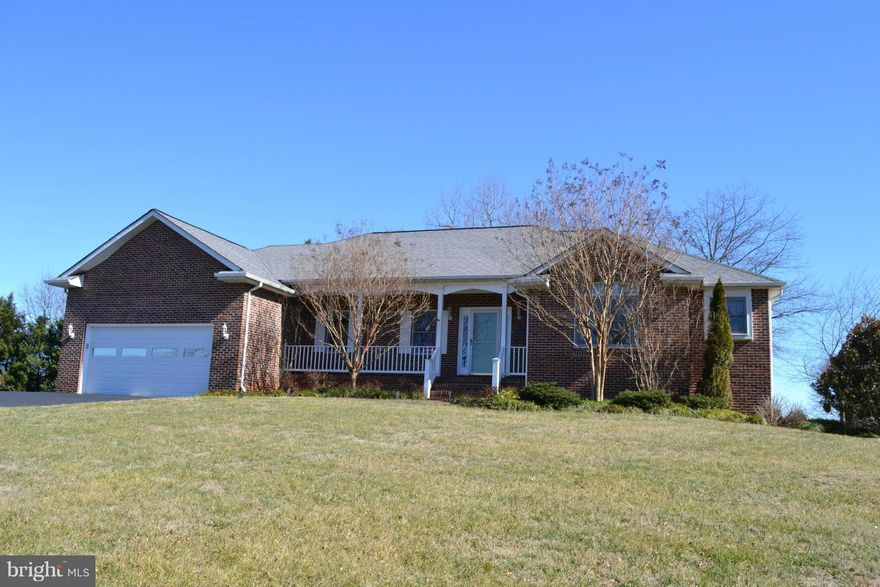 BEST OF BOTH WORLDS!! Custom built rambler w/ mountain views in front & water views from the back! 4 BR,3BA, new cherry floors, Master suite accented w/ jetted tub & WIC, separate dining room, kitchen / family room open concept w/ gas fireplace, attached 2 car garage , FULL FINISHED BASEMENT w/ large Rec rm w/ gas fireplace, pool table conveys, full bath, & laundry room. Just 2 miles to Town.