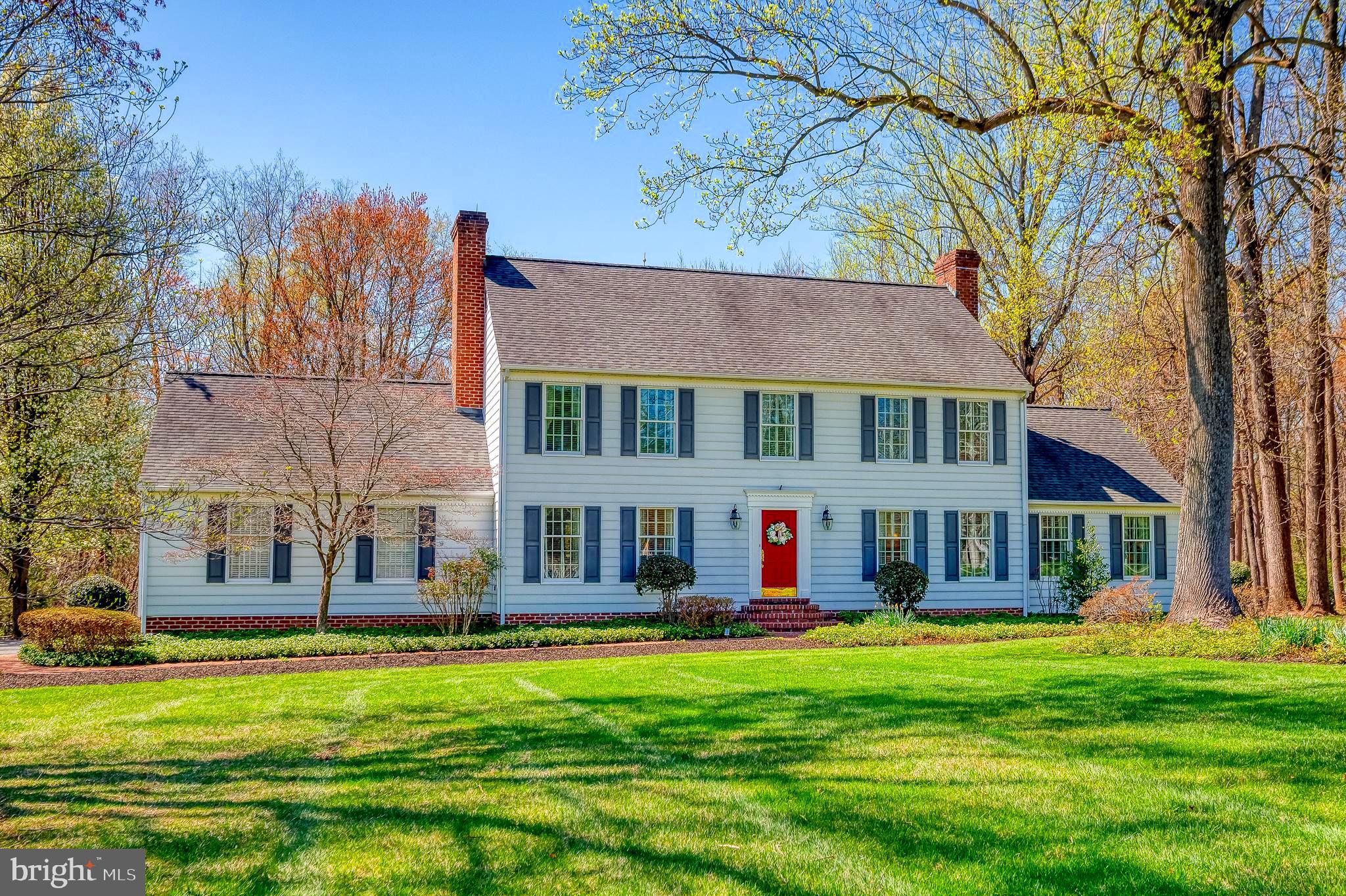 Absolutely charming center hall colonial in the sought after community of Long Green Manor. This beautiful home, situated on 2.76 acres, has been lovingly maintained by its original owners since 1975. With tons of updates over the years, this one aims to please! Enter into the grand foyer leading to the elegant LR w/gas fireplace (converted from WB); separate DR w/built-in corner cabinets; & warm cozy den/family room w/yet another fireplace! Gleaming HW floors throughout. The tastefully updated country kitchen boasts a huge bow window, granite countertops, large island/breakfast bar, stainless appliances - plenty of space for the gourmet cook! A focal point of the home is the awesome sunroom addition w/tons of windows, ceiling fan, tile floor, that can be enjoyed nearly all year round! Also on the main level is a convenient powder room & laundry room that provides access to the attached side-entry 2-car garage. The trek deck off the main level hallway leads to the beautiful & private wooded rear yard w/views of trees & nature! The upper-level primary BR is massive w/updated full bath & two closets w/extra space in the "eaves"; three additional bedrooms, pull down attic, & guest bath. In the walkout lower-level you will find a huge finished recreation room w/laminate plank flooring, wood burning stove, large utility/storage room, & a root cellar! Furnace 2020, water heater 2021, water purifier. This one's a real winner - see it before it's gone.