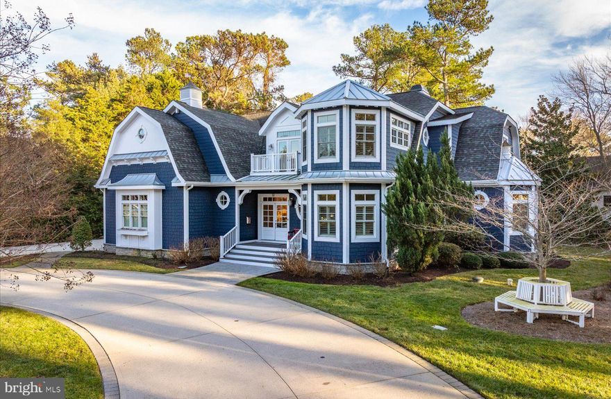 A community and residence designed for the most discerning buyer await in the highly sought-after enclave of Henlopen Acres. Perfectly positioned on a .52+/- acre corner parcel, just steps from one of the community’s private beach access points, 12 Rolling Road offers the ultimate blend of privacy, luxury, convenience, and coastal living. Thoughtfully designed, tastefully appointed, and meticulously maintained, this 5,100-square-foot coastal masterpiece leaves little to the imagination. Custom built by a respected local builder and lightly used as a vacation home, the residence features 6 bedrooms, 6 full baths, and 2 half baths, showcasing timeless finishes and exceptional functionality throughout. Coastal hues, pristine landscaping, and mature trees create a welcoming and elegant exterior, while the inviting interior floor plan is perfectly suited for both everyday living and entertaining. A grand great room, flooded with natural light, welcomes you home. The gas fireplace—flanked by custom built-in shelving—serves as the stunning focal point of this sophisticated space. The gourmet kitchen is a chef’s dream, featuring commercial-grade appliances, a wet bar, walk-in pantry, and a spacious island ideal for casual dining or hosting formal gatherings, with dining accommodations for ten. Just off the kitchen, a cozy keeping room showcases beautiful custom moldings and a striking gas fireplace, creating a warm and intimate retreat. The heart of the home is further enhanced by a well-appointed mudroom offering a convenient drop zone, powder room, laundry with pet wash, abundant cabinetry, and a secondary wet bar complete with dual beverage refrigerators—perfect for entertaining and everyday convenience. The primary suite is a true sanctuary, complete with a private office, sitting room, and a luxurious en-suite bath featuring a walk-in shower and soaking tub designed for ultimate relaxation. Upstairs, a spacious second-level family room with pool table provides an ideal setting for recreation and multi-generational living. This level also includes 4 additional bedrooms, 4 full baths, and a second laundry room, offering comfort and privacy for family and guests alike. Outdoor living is equally impressive, with a grilling station, patio overlooking a serene wooded backdrop, screened porch, and outdoor shower—perfect after a day spent at the beach. Additional highlights include abundant storage, oversized closets, an oversized two-car garage, and a conditioned golf closet, ideal for the avid golfer to safely store clubs, gear, and equipment in a climate-controlled environment. The Control4 home automation system offers convenience and efficiency to manage lighting, climate, and entertainment via your smartphone app. This is a rare opportunity to own a turnkey coastal home in Henlopen Acres, combining refined craftsmanship, generous living spaces, and unparalleled proximity to the private beach—all within one of the most coveted communities on the Delaware coast.