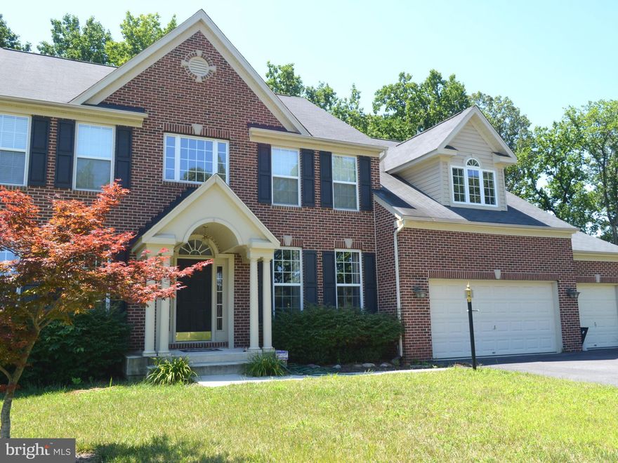 The WOW FACTOR is here! 3 fin.lvls of shear beauty and massive livg space.4 upp lev bdrms w/3 full up baths.Gleaming door to door hdwd flrs, 2 1st flr office's. Grmt kitch w/ dble ovens,gran counter,cabinets galore.LL boast wet bar and lounge,rec rm,gym,f bath w/ tub add'l huge fin.rm for bdrm #5, w/ space left to fin! But wait, there's more..A huge deck w/brick patio & wooded rear=Sold,Sold,Sold!