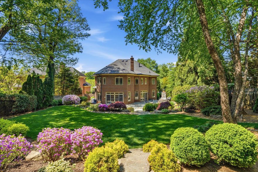 Set on more than half an acre of beautifully landscaped, park-like grounds, 6704 Honesty Drive is a timeless custom-built estate offering over 7,600 square feet of refined living in one of Bethesda’s most desirable neighborhoods. With exceptional scale, quality craftsmanship, and extensive recent updates, this home is designed for luxurious everyday living and effortless entertaining.
At the heart of the home is a stunning chef’s kitchen with brand-new Wolf and Sub-Zero appliances (2024–2025), upgraded cabinetry, and an oversized island for gathering. The kitchen flows seamlessly to a sunny breakfast area and glass-wrapped sunroom, all overlooking the lush backyard and opening directly to a refinished bluestone patio with a wood-burning fireplace, gas line for grilling, irrigation system, and professionally designed landscaping with natural boulders and mature plantings—creating a private outdoor retreat.
Upstairs, the luxurious primary suite is a private sanctuary with dual California Closets walk-ins and a spa-inspired bath featuring a steam shower, soaking tub, and new Phylrich fixtures (2024). Three additional spacious bedrooms each offer beautifully updated ensuite baths.
Designed for both grand entertaining and comfortable living, the home features gracious formal and informal spaces, including a formal dining room, inviting hearth room with gas fireplace, abundant natural light, hardwood floors, and two staircases connecting all levels.
The lower level offers exceptional versatility with a large recreation room with custom Rutt cabinetry, theater room wired for projection and surround sound, gym, and private guest or au pair suite with an upgraded ensuite bath.
Recent improvements include three new Carrier furnaces (2024), CertainTeed Landmark roof with copper gutters (2023), 75-gallon Bradford White water heater, Speed Queen laundry (2025), and fresh Benjamin Moore Aura interior and exterior paint.
Ideally located in the Whitman, Pyle, and Burning Tree school cluster and near top private schools, downtown Bethesda, and the Potomac River trail network, 6704 Honesty Drive offers the rare combination of privacy, luxury, and convenience.