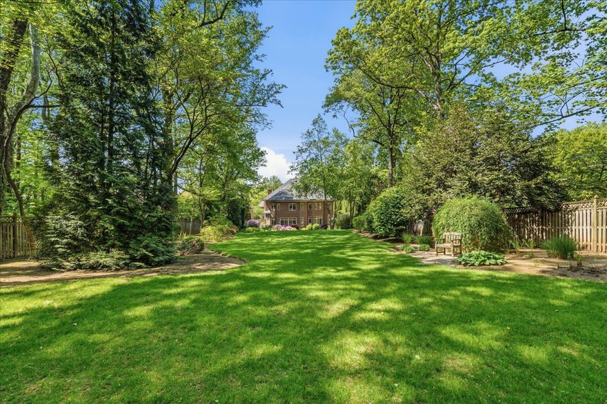 Set on more than half an acre of beautifully landscaped, park-like grounds, 6704 Honesty Drive is a timeless custom-built estate offering over 7,600 square feet of refined living in one of Bethesda’s most desirable neighborhoods. With exceptional scale, quality craftsmanship, and extensive recent updates, this home is designed for luxurious everyday living and effortless entertaining.
At the heart of the home is a stunning chef’s kitchen with brand-new Wolf and Sub-Zero appliances (2024–2025), upgraded cabinetry, and an oversized island for gathering. The kitchen flows seamlessly to a sunny breakfast area and glass-wrapped sunroom, all overlooking the lush backyard and opening directly to a refinished bluestone patio with a wood-burning fireplace, gas line for grilling, irrigation system, and professionally designed landscaping with natural boulders and mature plantings—creating a private outdoor retreat.
Upstairs, the luxurious primary suite is a private sanctuary with dual California Closets walk-ins and a spa-inspired bath featuring a steam shower, soaking tub, and new Phylrich fixtures (2024). Three additional spacious bedrooms each offer beautifully updated ensuite baths.
Designed for both grand entertaining and comfortable living, the home features gracious formal and informal spaces, including a formal dining room, inviting hearth room with gas fireplace, abundant natural light, hardwood floors, and two staircases connecting all levels.
The lower level offers exceptional versatility with a large recreation room with custom Rutt cabinetry, theater room wired for projection and surround sound, gym, and private guest or au pair suite with an upgraded ensuite bath.
Recent improvements include three new Carrier furnaces (2024), CertainTeed Landmark roof with copper gutters (2023), 75-gallon Bradford White water heater, Speed Queen laundry (2025), and fresh Benjamin Moore Aura interior and exterior paint.
Ideally located in the Whitman, Pyle, and Burning Tree school cluster and near top private schools, downtown Bethesda, and the Potomac River trail network, 6704 Honesty Drive offers the rare combination of privacy, luxury, and convenience.