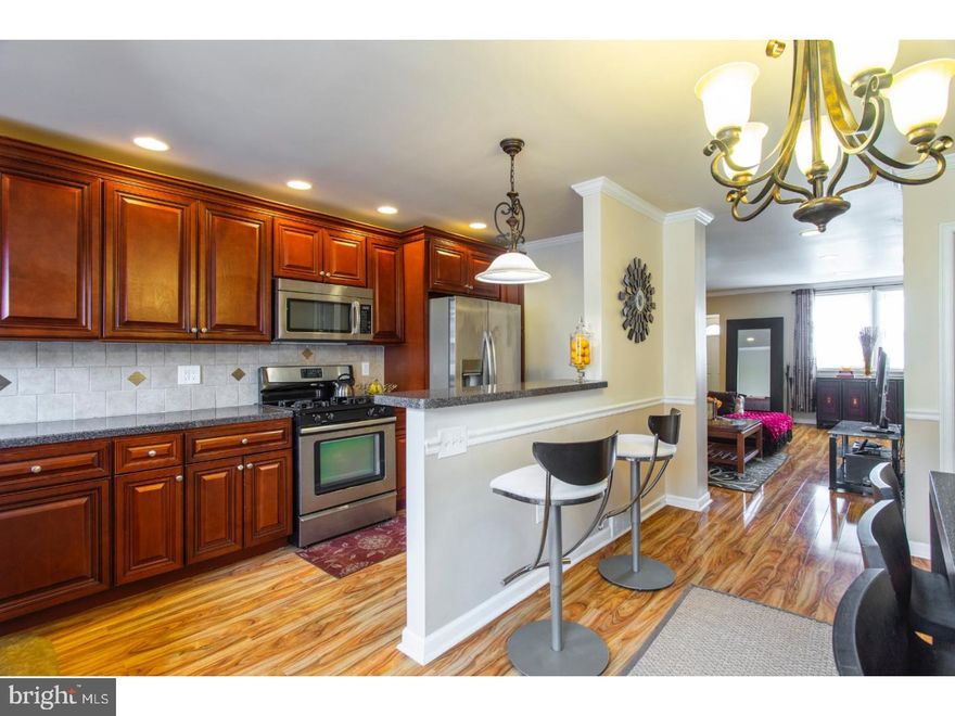 Welcome home to this well-maintained, rehabbed 3 bedroom, 1.5 bath home in highly desirable East Mount Airy. Main level includes spacious living/dining areas with beautiful, high-gloss flooring, recessed lighting, chair rails and crown molding throughout. The gorgeous, eat-in kitchen includes 36" cherry cabinetry with crown molding, an abundance of counter space with gorgeous dark countertops, a breakfast bar, tiled backsplash and stainless steel appliance package with a gas range, built-in microwave and dishwasher. Exit the French doors to the large deck which is perfect for enjoying your morning coffee or summertime grilling/entertaining. The second level has beautiful refinished, hardwood floors throughout, an abundance of closet space including a walk-in closet in the master bedroom and ceiling fans. Fully updated ceramic tiled, hall bathroom with newer tub, newer fixtures pedestal sink, skylight and ceramic tiled floor. The finished basement, with ceramic tiled floors, a powder room and separate laundry area, is great for your office, man/woman cave and/or room for storage. Enjoy the convenience of off street parking in your driveway or 1 car garage with inside access to the basement. Enjoy your own slice of serenity right outside your door relaxing on the patio in the newly landscaped front yard. Over 1100 square feet with lots of closet space, storage and room for entertaining! Centrally located, minutes from 309, PA turnpike, 476, shopping, schools, restaurants and a few footsteps from public transportation. Just pack your bags and move right in!