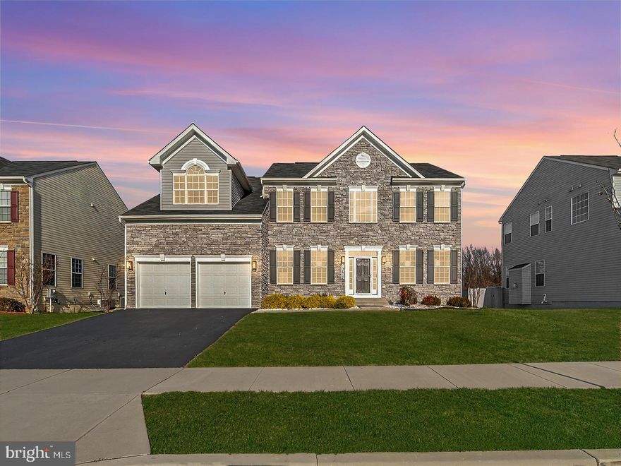 Discover this spectacular Colonial-style home, built in 2019, located in the sought-after Woodburn Estates community. This gorgeous residence offers 6 bedrooms (2 in the basement NTC), and 4 full bathrooms across a generous 5,992 total square feet, including a 100% finished basement. The gourmet kitchen is equipped with stainless steel appliances, including a Double Oven, Down Draft Cooktop, Built-in Microwave, Dishwasher, and Refrigerator. Enjoy comfortable living with central, zoned cooling (Electric) and heating (Propane). The home also features a convenient main-floor bedroom and full bathroom, a main-floor laundry room with a Washer and Dryer In Unit, plus a 2-car attached garage.