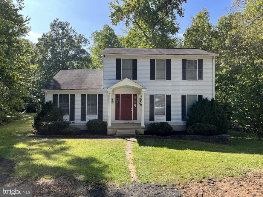 Lovely 3 bedroom, 2 .5 bath single family home  features hardwood floors in foyer, spacious family room and living room. Formal  dining room leads to large eat in kitchen which overlooks scenic backyard and deck. Combined laundry room and storage area. This 2.42 acre lot has an oversized detached 2 car garage which can also be used for storage or a workshop and a driveway that can accommodate multiple vehicles. Home sits in the middle of lot surrounded by trees and beautiful landscaping.  Don't miss out on this great opportunity property is eligible for USDA loan.