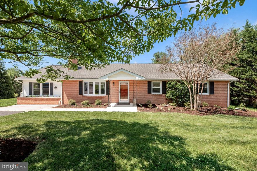 NO HOA and NO CITY TAXES! Welcome to this beautifully maintained brick rancher nestled on a scenic 0.46-acre lot in Myersville, backing to the Musket Ridge Golf Course and surrounded by peaceful wooded views.

This thoughtfully designed ranch-style home offers over 3,300+ finished square feet with 3 official bedrooms and 3.5 baths, plus an additional finished room on the main level, ideal for a guest room or home office. The spacious primary suite—created from a converted former garage space—is privately situated on one end of the home, while the remaining bedrooms are located on the opposite side, providing excellent separation and privacy.

The main level showcases gleaming hardwood floors, a bright and inviting living room with a wood-burning fireplace, and a large bay window that fills the space with natural light. The eat-in kitchen provides ample cabinetry and table space, while the separate dining room opens to an expansive deck—perfect for entertaining or simply enjoying the tranquil golf course backdrop.

The fully finished walkout basement adds incredible additional living space, complete with a second wood-burning fireplace, full bath, and flexible areas for recreation, entertaining, or multi-generational living.

Outdoor living is just as impressive with a spacious deck and a beautifully designed hardscape patio—ideal for gatherings, relaxing evenings, or taking in the scenic golf course and wooded views. Additional features include a paved driveway, shed, and mature landscaping.

Located in the desirable Middletown school district and offering the perfect balance of privacy and convenience, this home is ideal for buyers seeking one-level living with space, views, and room to grow.

Expected on the market at the end of May—just in time to capture peak spring/summer buyer demand!
Beat the rush...Schedule your showing today! *Professional photos to be uploaded May 20th