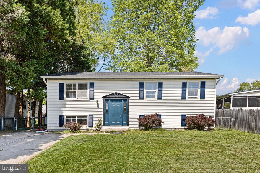 Welcome to 20 Dorsey Lane! This newly renovated stunning 4-bedroom, 2-full bathroom home makes a grand first impression with a sprawling living room highlighted by soaring vaulted ceilings and abundant natural light. The heart of the home is the designer kitchen, featuring gorgeous navy cabinetry accented with elegant gold handles, brand-new countertops, a stylish backsplash, and a full suite of modern appliances. The kitchen flows seamlessly into the dining room, where sliding glass doors open to a large backyard deck, perfect for entertaining or enjoying quiet mornings. Completing the main level are three generous-sized bedrooms and a pristine, fully updated bathroom.

The lower level offers incredible versatility, providing a massive second living area and a spacious fourth bedroom adorned with a beautiful barn door entrance. With a second full bathroom located on this floor, the lower level is ideally suited for a guest suite, home office, or private retreat. Every detail of this home has been thoughtfully curated, from the high-end finishes to the move-in-ready layout. Don't miss your opportunity to own this turn-key residence—schedule your tour of 20 Dorsey Lane today!