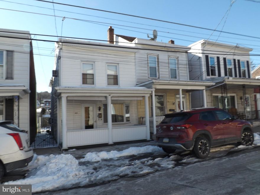 New Lowered Price!!! This is a well maintained three bedroom one and a half bathroom, half double home in the Borough of Saint Clair. As you enter the home from the front entrance you enter into a nice large open living room, then a separate dining room, and off of the dining room is a nice roomy kitchen. Off of the kitchen on the first floor is a half bath/laundry room. The second floor features three nice sized bedrooms, note; one bedroom is a walk through. There is also a walk up attic for all of your storage needs. The basement features an EFM Oil Boiler, with two oil tanks, and a 100 amp electrical panel box. The rear yard features a storage shed, and a nice side porch.