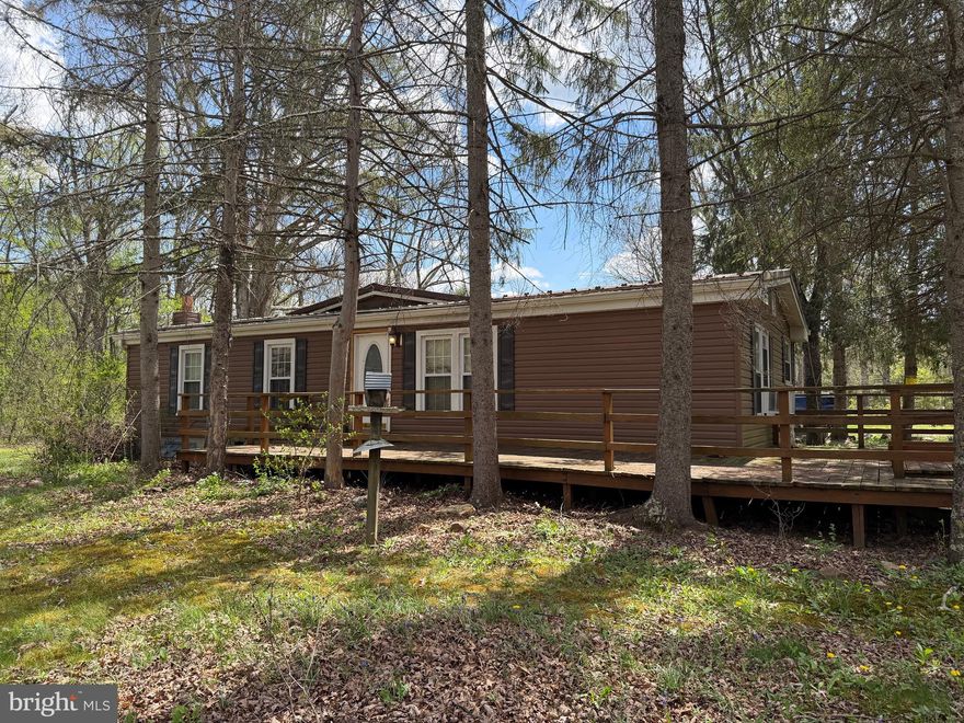 Nestled in the peaceful mountain setting of Flintstone, this three-bedroom, one-bath ranch-style home sits on 5 private acres, offering the perfect escape for those seeking seclusion and outdoor adventure. 
It has a detached carport, a front wood deck and a covered rear deck for morning coffee or evening sunsets, and a metal roof perfect for listening to the rain. 
The home itself offers a solid layout with great potential but does need some love—perfect for buyers looking to put their personal touch on a property and build equity. Whether you're envisioning a cozy full-time residence, a weekend getaway, or a hunting retreat, this property provides a rare opportunity to create something truly special.

If you're looking for privacy, acreage, and the charm of a mountain setting, this property is ready for its next chapter.