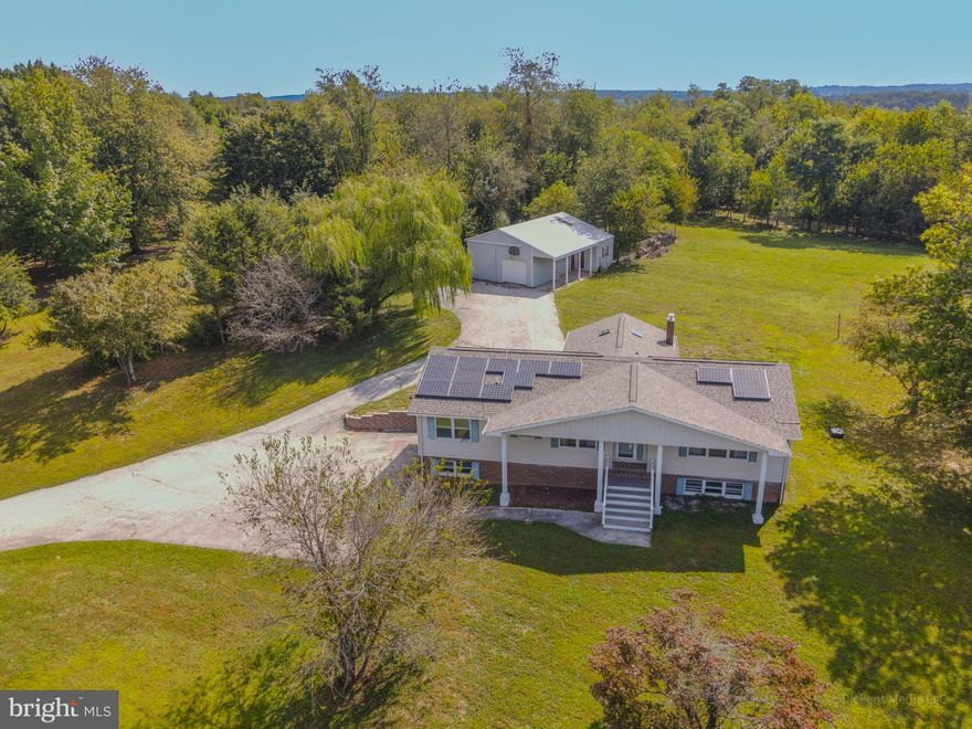 3+ Acre Retreat with $200K+ in Renovations & Multi-Family Potential

This private 5-bedroom, 4-bath home on a large corner lot offers over 3 acres of peace and space to spread out. Recently updated with over $200,000 in renovations, the home features brand new floors, drywall, trim, lighting, and a redesigned open layout. The gourmet kitchen shines with KraftMaid cabinetry, quartz countertops, a large island, and professional gas range. All bathrooms have been beautifully remodeled, including a double vanity in the main bath.

The vaulted wood-ceiling sunroom overlooks the property and provides the perfect space to watch deer and wildlife. Major system updates include a new HVAC with propane backup, updated electrical, new plumbing, roof, and solar panel replacements.

The lower level is roughed in for a second kitchen and two baths, with its own entrance—ideal for multi-generational living, rental potential, or conversion back to a legal two-family home. A detached garage with workshop and double-tier carports add to the appeal.
Live upstairs while you pick the finishing touches for lower level, all the hard stuff is done, just the sexy finishing touches to go- Sellers loss is your gain!
*** There is currently a 5.25% VA loan which could be assumed by some buyers.