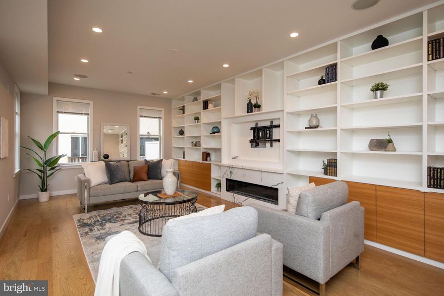 Welcome to your new home in the heart of the charming Bella Vista neighborhood! This stunning corner house boasts over 3600 square feet of above-grade living space, offering ample room for comfortable living and entertaining.

As you step inside, you'll be greeted by an abundance of natural light, thanks to its favorable west and south-facing orientation. Hardwood floors span the entirety of this meticulously maintained residence, creating a warm and inviting ambiance throughout.

The main level features a chef's dream kitchen equipped with top-of-the-line Wolf and Sub-Zero appliances, perfect for preparing gourmet meals. Adjacent to the kitchen, you'll find a spacious dining area and a convenient powder room, ideal for guests.

Upstairs, the second floor showcases a grand living room adorned with built-in shelves and a cozy fireplace, providing the perfect setting for relaxation and gatherings with loved ones, a large bedroom full bathroom and laundry room.

On the third floor, you'll discover the luxurious master suite, complete with a private master bathroom and a second bedroom, offering versatility for guests or a home office. Additionally, a convenient wet bar provides added convenience for entertaining.

Step outside to your expansive roof deck, offering breathtaking views of the city skyline – the perfect spot for enjoying morning coffee or evening cocktails with friends.

For those who love outdoor living, the generous rear yard provides ample space for grilling, gardening, and enjoying the fresh air.

Additional highlights of this exceptional home include a finished basement with a full bathroom, offering flexibility for use as a home gym, media room, or guest quarters. Plus, a spacious garage with 15-foot-high ceilings provides ample storage space for all your belongings.

Conveniently located within walking distance to Whole Foods Market, ACME, Starbucks, and Center City, this home offers unparalleled convenience. You'll also be steps away from the beautiful Palumbo Park and Seger Park, perfect for outdoor activities and relaxation.

Located within the sought-after Meredith school catchment, this home offers the perfect blend of luxury, comfort, and convenience. Don't miss your chance to make this Bella Vista gem your own – schedule your private tour today!