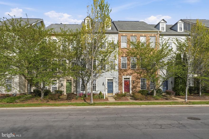 Discover the charm of this beautifully maintained townhouse nestled in the desirable New Bristow Village. With 2,666 sq. ft. of thoughtfully designed living space, this home offers a perfect blend of comfort and style. Fresh paint throughout this inviting Keaton Model and it is adorned with elegant crown moldings and warm hardwood floors. The spacious family room flows seamlessly into the eat-in kitchen, featuring a convenient island, ample pantry space, and modern appliances, including a gas range and built-in microwave. Retreat to the primary suite, complete with a luxurious soaking tub and walk-in shower, ensuring a serene escape at the end of the day. Two additional bedrooms and well-appointed bathrooms provide plenty of space for guests or a home office. Outside, enjoy the tranquility of your private rear yard views, which backs to lush trees and open common areas, perfect for relaxation or entertaining. The community pools offer a refreshing getaway, while the deck invites you to savor morning coffee or evening sunsets. Located in a prime suburban setting with easy access to commuter options, this home is ideal for those seeking convenience without sacrificing comfort. Close to restaurants, shopping, retails, medical, and just a short drive to the beautifully revived Olde Town Manassas. The spacious two car garage and additional driveway parking, will give you all the space you need for bikes, storage and more. New Bristow Village is a 480-acre, 570-home planned community in Bristow, VA, featuring traditionally styled homes and 33 acres of green space, and extensive amenities. Residents enjoy a clubhouse with a fitness center, a swimming pool, four playgrounds, tennis/basketball courts, two ponds, and proximity to Bristow Station Battlefield Heritage Park. Make this one yours before it's too late.