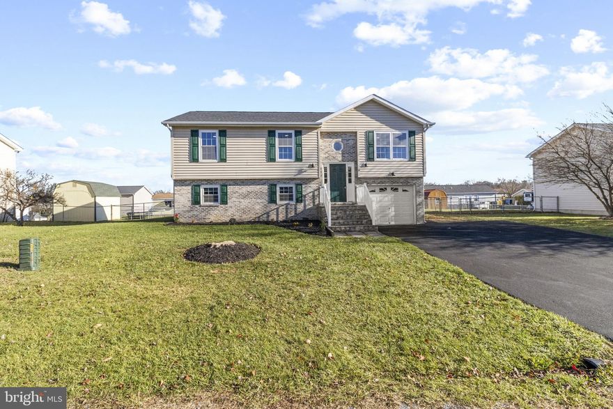 Great home with many recent updates to include a new roof , updated kitchen with stainless steel appliances and granite counter tops. Brand new paint and flooring throughout the house as well as new fixtures, faucets,  a new sealed driveway and so much more. Home has 4 bedrooms and 3 full baths with two separate living room areas. One living room on each level. The full bath and master bedroom on lower level makes it great for an in-law suite or separate office. The upstairs has an additional 3 beds and two baths for the rest of the family. Off the kitchen you have a deck with steps down into a nice level backyard that is fenced in.