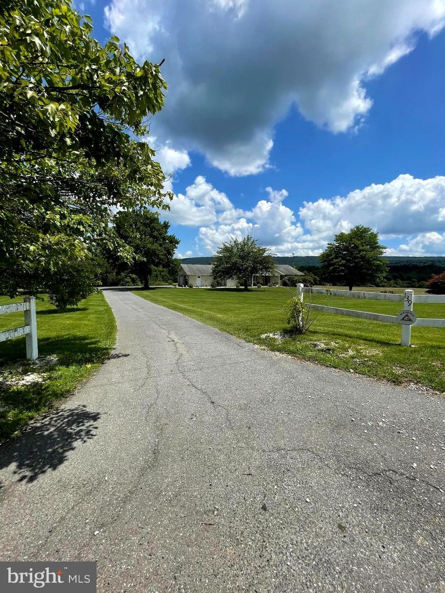 Welcome to your dream retreat! Nestled on 50 acres of picturesque landscape, this enchanting home exudes timeless elegance with its beautiful white split rock exterior. The moment you arrive, you'll be captivated by the serene surroundings and breathtaking panoramic views that stretch as far as the eye can see. This custom rancher has it all, as you step through the front door, you're greeted by a warm and inviting atmosphere. The interior is adorned with tasteful finishes, featuring a seamless blend of modern comforts and rustic charm. With three bedrooms, three bathrooms, finished basement with walk out, two fireplaces, new HVAC system, main floor laundry and attached garage. Outside, a world of relaxation and recreation awaits. Step onto the deck, where you can savor your morning coffee while soaking in the captivating views of rolling hills and lush greenery. The property also features a very nice inground pool, providing the perfect oasis for sun-filled days and refreshing dips with a fifth garage for pool equipment. Car enthusiasts and hobbyists will appreciate the large, detached garage, providing ample space for vehicles, tools, and any creative projects you might have in mind. The interior is ready for a new owner to come make this space their own, everything is in great condition and has been well maintained over the years.  The acreage in back is already cleared and currently being used to grow wheat that will be harvested before settlement. Lots of potential here, could farm the land or lease for farming. Whether you're seeking a peaceful weekend getaway, or a full-time residence surrounded by nature's splendor, this home offers the ultimate escape. Embrace a life of tranquility, revel in the beauty of nature, and create cherished memories with family and friends. Don't miss this once-in-a-lifetime chance to own a slice of paradise. Come and experience the allure of this magnificent property before it's gone!

Owner occupied, no same day appointments.  Being sold As-Is.
