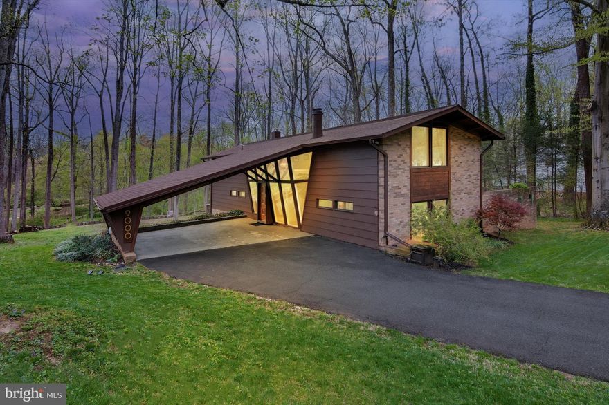 House will be open between 10AM-12PM on Sunday, April 20! Welcome to Mantua with a unique opportunity to live in an immaculate custom-designed contemporary home with architectural flair. This beautiful 4-bedroom, 2 ½ bath home is a blend of rustic character and modern charm with a relaxed open-floor plan. Sitting on over two-thirds of an acre, there is plenty of outdoor space to entertain while also providing privacy. A long driveway takes you up to the 2-car carport and welcoming front entrance. As soon as you enter the home you are met with plenty of natural light through the large, newly replaced double-pane custom windows. The large living room is warm and inviting with new floors and a dining area with a beautiful stone accent wall. Glass sliding doors open up to the deck. On the main level you will find an updated half bathroom and a pantry, in addition to two spacious living spaces. Stairs take you down to a walk out basement. An open staircase takes you to the upper level with 4 bright bedrooms with large windows and a convenient upstairs laundry. Both full bathrooms upstairs have been thoughtfully updated. New roof and HVAC! This home is minutes to the Dunn Loring Metro Station and the popular Mosaic District with tons of shopping, dining, entertainment, nature trails, and more! Right off Route 50, and with close proximity to Route 66, 495, and only 10 minutes away from Tysons Corner shopping. Less than a mile from Mantua Elementary School. A short walk down the road takes you to the Eakin Park entrance with tennis courts, a basketball court and tot lots. Don’t miss the opportunity to make this hidden gem your home today!