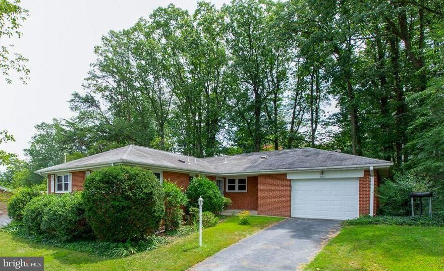 Opportunity! 3 Bedroom/3 Full Bath solid brick rambler with  2400+ finished sq ft and oversized attached garage.  Close to downtown Silver Spring, DC, White Oak, FDA. Minutes to 495.  Two fireplaces, hardwood floors, separate dining room, two full bathrooms on main level, eat-in kitchen.  Separate entrance and full bath on finished lower level that features a wood burning fireplace. Home has been meticulously cared for. Furnace replaced in 2010, water heater in 2011.  Enjoy the enclosed porch with walls of windows as you gaze upon the lush backyard. Appraised above list! Montgomery County schools. Open Sunday, Aug 18 from 2-4.