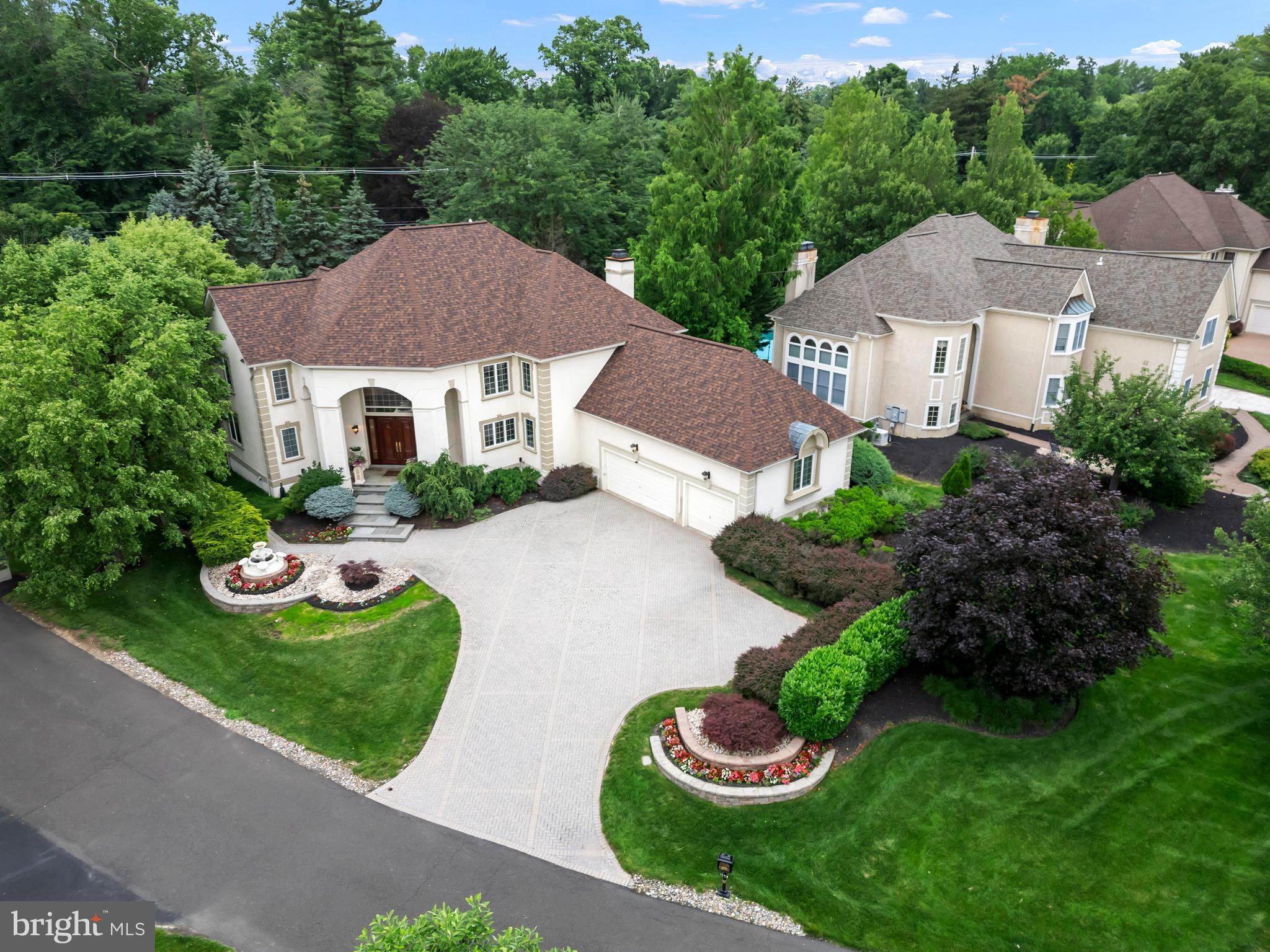 Luxury abounds in this custom-built Gigliotti home, located in the prestigious gated community of Rydal Green! Step into the impressive two-story foyer, highlighted by a dramatic turned staircase that opens to a grand, step-down two-story living room featuring a stunning wall of windows. Designed with exquisite architectural details, rich millwork, and an abundance of custom moldings, this home offers sophisticated finishes throughout. Gleaming hardwood floors extend across the main living spaces.
The large formal dining room seamlessly flows into a charming sunroom with heated tile flooring—perfect for year-round enjoyment. French doors lead to a private library/study complete with handsome built-in wood cabinetry.
The custom gourmet kitchen is a chef’s dream, opening to a bright breakfast room and an inviting fireside family room—ideal for both entertaining and everyday living.
Upstairs, the magnificent primary suite boasts a custom barrel ceiling, separate his-and-hers walk-in custom closets, and a luxurious spa-like bathroom featuring a whirlpool tub, oversized steam shower, dual vanities, and heated tile floors. Two additional bedrooms, each with their own ensuite full baths, complete the second level.
The finished lower level offers exceptional space and flexibility, including a large recreation room, play area, office, full gym with sauna, a fourth bedroom with full bath, and custom-built steel Bilco doors for direct basement access.
Custom appointments throughout include: Elevator servicing all three levels; Heated 3-car garage; Central vacuum system; Whole-house intercom; Built-in surround sound; Three separate HVAC systems; Security system and much more...
Exterior highlights: New architectural shingle roof (2022); New Whole-house generator (2023); Updated oversized Trex deck; Extensive paver patio; Lavish, professionally designed landscaping; Full irrigation system for effortless maintenance.
Strategically nestled in the upscale suburb of Rydal, this location offers convenient access to major highways and is less than three minutes from the nearest SEPTA stop. It provides swift connectivity to the city of Philadelphia as well as easy access to the Pennsylvania and New Jersey Turnpikes, and regional train lines.
This impeccably maintained home offers unparalleled quality and is ready for the most discerning buyer. A true gem in Rydal Green—schedule your private tour today!