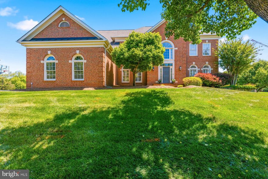 OPEN: Friday 5/8 4-6PM; Saturday 5/9 2-4PM & Sunday 5/10 4-6PM*****Discover an exquisite blend of elegance and comfort in this stunning Colonial residence nestled in the prestigious Regency subdivision. Spanning an impressive 4,691 square feet on the top two levels, this home boasts five spacious bedrooms and five full baths and two  half luxurious bathrooms. Step inside to find a grand entryway adorned with crown moldings and chair railings, leading into a gourmet kitchen that is a chef's dream. Featuring stainless steel appliances, including a built-in microwave, wall oven, and a generous island, this kitchen is perfect for culinary creations. The adjoining family room, complete with a cozy fireplace, invites gatherings and cherished moments. For those working from home, there is a large den/office with french doors for privacy. The thoughtful layout includes a formal dining room and an eat-in kitchen, ensuring ample space for hosting. In 2024, the formal living room was converted into a 2nd main floor primary bedroom, complete with a sitting area and a full bathroom, which is great for multi-generational living. Enjoy the convenience of additional features such as built-ins, recessed lighting, and walk-in closets that elevate everyday living. Leading from the breakfast nook is a screened porch and a large deck, allowing for outdoor entertainment. The outdoor yard is equally impressive, set on a corner lot of nearly half an acre, providing a serene backdrop for outdoor activities. The attached three-car garage with side entry adds to the home's functionality and curb appeal. With a full, daylight basement that is heated and improved, that includes a bar area, recreation area, work-out room, yoga/flex space and ample storage. The possibilities for customization are endless.                                                                                                                                                                                                    NOTABLE UPDATES: ****2025 Carpet replaced on the main floor, second floor, and basement.  2024: Main level bedroom sitting area and full bathroom. 2024 Attic Insulation sealed; 2023 Upstairs AC Unit replaced, 2023 Primary Bedroom on second floor updated, 2021 Asphalt Driveway replaced, 2020 Main floor AC and Heating unit replaced, 2019 Upper level Primary Bathroom windows replaced, 2017 Roof, Gutters and Front Door replaced. 2017 Hot water heater replaced.****
Located within walking distance to Loudoun Station where you will enjoy restaurants, shopping, and the Silver line metro station. Dulles Int. airport and the Dulles Greenway offers an exclusive lifestyle without compromising on accessibility. Experience the perfect harmony of luxury and comfort in this remarkable home.
--