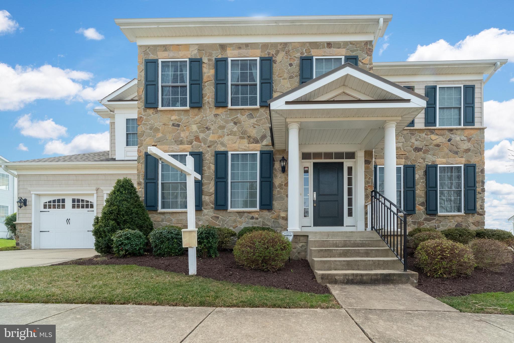 Stately Elegance in Perry Hall! 5139 Scenic Drive is a home of distinction, nestled in the Moores Meadows Subdivision. With community amenities such as a luxurious outdoor pool, a centrally located community center and a walking/jogging path, this home offers a dashing new lifestyle! This home is equipped with smart-home technology. Turn on & off lights, unlock doors, and shut off water, all remotely. Step inside and bask in the 5,100+ finished square feet of living space. You'll be welcomed with 9' ceilings (on all levels), majestic fresh paint, gleaming hardwoods and fine millwork. The over-sized chef's kitchen is an entertainers delight, with expansive eat-in breakfast room and rear entry to the screened porch. The attached, sun-filled family room boasts a gas fireplace with classic moldings surrounding the mantle. The main level includes a master suite with full bathroom. Upstairs, the owners suite is large, yet sensible. His & hers walk-in closets with shelving systems, a separate sitting room and vast bathroom with jetted tub round out this space. Also upstairs, a third bedroom with an en suite bathroom and 4th and 5th bedrooms share a Jack n Jill bathroom. 3rd Floor laundry room offers added convenience and practicality. The basement is 'the one' you've been dreaming of; with wet bar, movie theater, home gym and walk-out stairs. Outback, the picturesque stone patio with custom fire pit and professionally landscaped, fenced yard will have you saying WOW!