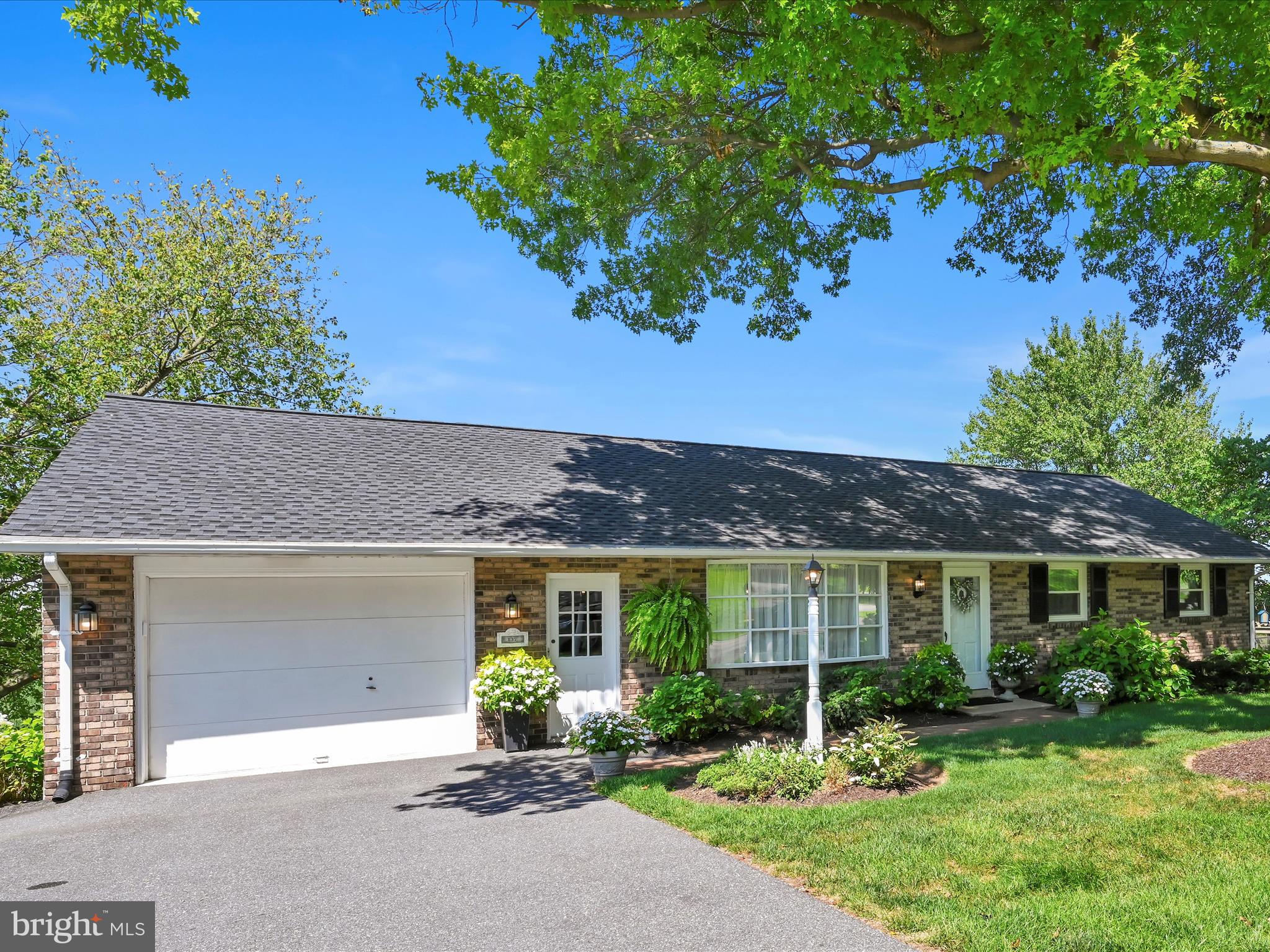 Welcome to this charming four bedroom, two full bath ranch home tucked within a mature neighborhood that exudes peace and timeless appeal. Perfectly positioned on a gentle rise, the property offers sweeping views of a valley of pastures and farmland, creating a picture perfect background in every season. Inside, the home features an upgraded kitchen and modernized bathrooms, blended comfort with contemporary style. The main level flows with ease offering bright, welcoming living spaces that invite both everyday living and entertaining. Downstairs the daylight basement expands your options with a spacious recreation room anchored by a wood burning fireplace, the perfect setting for gatherings or quiet evening at home. The generous layout makes this level ideal for a media space, hobby room or cozy retreat. The home celebrates the perfect blend of rural Lancaster County Farmland view, modern comforts within a well established community.