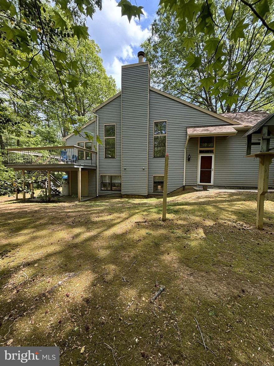 Estate sale being sold AS IS. Great location and lots of natural light. End unit with brand new roof.  HOA fees only $135 per month.  Interior needs updating and carpet removed, but this spacious end unit has lots of potential and great views to private woods in the rear.  Two assigned parking spaces. Convenient location.
