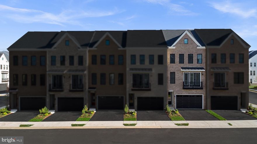 Find a brand new TOWNHOME by Van Metre Homes at WEST PARK in Brambleton, VA, ready for you to move in IMMEDIATELY. Step into the Tate 22-F2 – Homesite 4503 at West Park III—a two-car, front-load garage townhome with three bedrooms, two full bathrooms, and three half bathrooms. The versatile floorplan was designed for function and flow, with a heart-of-the-home gourmet kitchen, a flex space ready to be the perfect reading nook or work-from-home set-up, and bedrooms with spacious walk-in closets for effortless living. Offering an impressive 2,882 square feet spread across four levels and 9 ft. ceilings on all levels. At the heart of the home separating the dining room and great room, the spacious central kitchen awaits, a culinary haven, complete with an kitchen island, soft-close cabinets, quartz countertops, and stainless-steel appliances.  Enjoy a spacious outdoor deck off the great room and a balcony off the dining room. Venture to the upper level and discover an indulgent primary suite boasting a generous walk-in closet and a spa-like 4-piece luxury bathroom. Pamper yourself in the oversized shower with a built-in seat and enjoy the convenience of double sinks. This level also hosts 2 additional bedrooms, 1 full bath, and a well-placed laundry room. On the fourth floor, find a loft and spacious rooftop terrace. But the luxury doesn't end there. On the ground level, discover a welcoming foyer and a rec room with an additional half bathroom and easy internal access to the large garage. Being a new build, your home is constructed to the highest energy efficiency standards, comes with a post-settlement warranty, and has never been lived in before! Take advantage of closing cost assistance by choosing Intercoastal Mortgage and Walker Title. This residence is not just a house; it's an experience, a harmonious blend of thoughtful design and contemporary luxury. Make your move now. Schedule an appointment today! ----- Welcome to West Park III, a vibrant neighborhood of dreamy townhomes with rooftop terrace options in the award-winning community of Brambleton, VA. Experience an exceptional living experience in Brambleton, a flourishing community where modern living meets suburban charm. This family-friendly community offers miles of trails, tot lots, parks, pools, highly sought-after schools within walking distance, and so much more at your fingertips. With the bustling Brambleton Town Center just down the street, you can enjoy endless shopping, dining, and entertainment options. Rise to new heights at West Park III and experience the perfect blend of comfort, convenience, and connectivity—a place where cloud nine is just the beginning. ----- Other homes sites and delivery dates may be available. Pricing, offers, and availability are subject to change without notice. Images, renderings, and site plans are for illustrative purposes only and may not reflect actual homes or features. Some images and renderings may depict interior designs created in collaboration with AI or may represent a similar home. Additional terms and conditions may apply. Please see a Van Metre Sales Advisor for details.