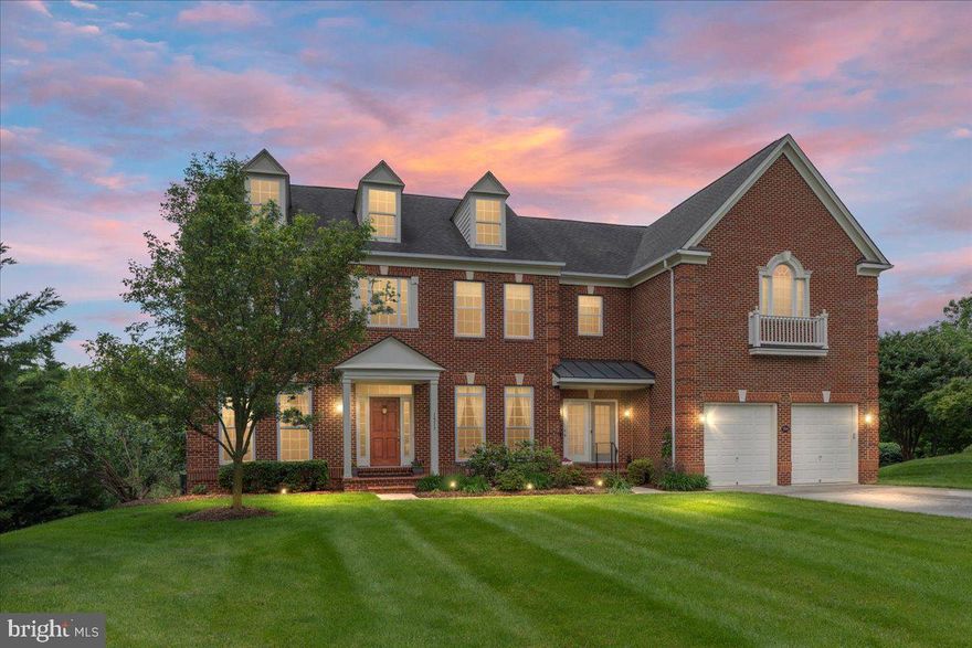 A rare opportunity to own the largest model in the Morlyn Hills neighborhood--more than 6500 square feet when including the fully finished basement.  Situated on a premier lot and in immaculate, move-in-ready condition, this home is competitively priced and an exceptional value. This home features 4 bedrooms, 4.5 baths, and an impressive array of upgrades throughout.
From the moment you enter the vaulted foyer, you’ll appreciate the exquisite details: rich trim work, hardwood flooring across the entire main level, and abundant natural light flooding through windows galore. The heart of the home includes a soaring two-story great room with a gas fireplace, adjoining a sunroom, and a gourmet kitchen equipped with double wall ovens, gas cooktop, stainless steel appliances, built-in microwave, and an expansive walk-in pantry. An eat-in island and tucked-away bar area provide perfect functionality for gatherings. Rarely found, the main level boasts two private offices perfect for working from home.
Upstairs, retreat to the luxurious primary suite featuring FOUR walk-in closets, a sunken soaking tub, dual vanities, and a separate oversized shower. An additional bedroom offers its own private bath and walk-in closet. Two generously sized bedrooms share a convenient Jack-and-Jill bathrooms.
The finished walk-out basement offers an entertainer’s dream with a full bath, dedicated media room, plus two additional flex rooms and plenty of storage space in the utility room. Outside, enjoy your private oasis with a Trex deck, sun-setting retractable awning, and a custom rocked pavers, all overlooking mature trees and the peaceful preserve.
Additional highlights include a two-car attached garage, solar shades, and sun-blocking film on upper rear windows for energy efficiency.  A historic private railroad line runs behind the home, it is one of the last of its kind in the U.S, offering a unique charm.
This extraordinary home blends timeless Colonial style with every modern luxury, and is ready for its next discerning owner.