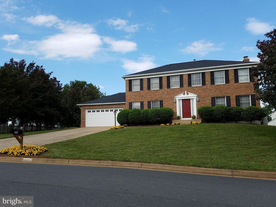 Impeccably cared for rare gem in Spring Grove Farm! Don't miss this exceptional 5 Bedroom SFH positioned on a premium half acre corner lot.  This treasure has stayed within the same family since they built it in 1987, and their pride of ownership shines throughout. Rest easy knowing major expenses - the roof, HVAC and hot water heater have all been replaced in the last 4 years! You'll appreciate the elegant hardwoods in the foyer, the natural light flooding through plentiful windows, and the luxury of a spacious walk-in closet in the primary bedroom. The basement is perfect for an in-law suite with a full bath and wet bar - ideal for multi-generational living or creating rental income! This home offers incredible value and potential in a sought-after neighborhood.  The home is adjacent to a cul de sac and open fields perfect for play and picnics!  Lovingly maintained, it retains its original character and charm while offering incredible potential for your personal touches. It’s ready for modern upgrades when you're ready.  With its solid foundation and recently updated essential systems, this home provides the perfect canvas for creating your dream space without the premium price of already-renovated properties. This is a rare opportunity to build equity while customizing a well-built, well-cared for home in a desirable neighborhood.