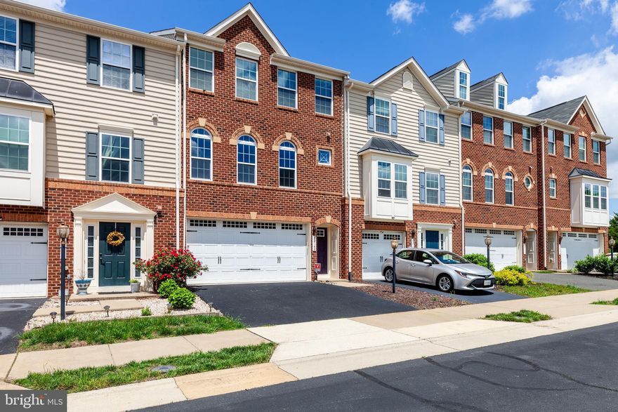 THIS BRIGHT, BEAUTIFUL TOWNHOME, LOCATED IN PEACEFUL & IDYLLIC SEVEN HILLS, BOASTS AN OPEN FLOORPLAN AND TIMELESS DETAILS THROUGHOUT.  ** Entry level with separate full bathroom and gorgeous gas fireplace provides ample space for home office, playroom, or fitness room - and leads out to fully fenced private backyard. ** Stunning main level with gleaming wood floors and tall windows flows seamlessly from living to dining areas. Well-lit gourmet kitchen with granite countertops, island, and pantry is the center and heart of the home, open to the dining area with designer lighting, formal living room to the left and family room to the right complete with sliding glass doors open to a spacious Trex deck..  Plenty of space for living, playing and entertaining!  ** The upstairs boasts a huge Main Suite with dual walk-in closets and attached bathroom with oversized dual vanity and large bathtub. Two additional bedrooms and 1 full bahtroom round out the upstairs level.  ***  2-car garage with storage space & 2 car driveway (not pictured). **  Wonderful, expansive and friendly community with Pools, Clubhouse, Trails, Playgrounds & Parks Galore!  **  Only 12 years young and low HOA fees add to the Move-In Ready status of this great home.