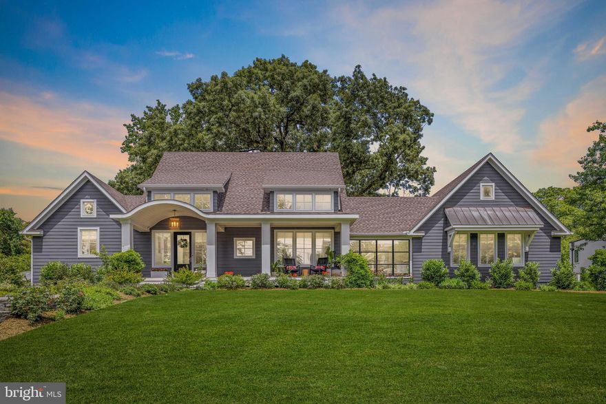 Glorious modern farmhouse stands proudly on prestigious Homewood Road. Over half an acre on the most coveted street in Annapolis. This is a rare opportunity to own a water view, water access, nearly new construction home in the Ferry Farms community, with an emphasis on seamless indoor-outdoor living.
Located just over the Naval Academy Bridge and adjacent to Greenbury Point and the USNA golf course, Ferry Farms allows quick access to downtown Annapolis, but in a quiet waterfront neighborhood setting on the Broadneck peninsula and without city property taxes. 
The previous home was torn down and this completely custom home was rebuilt in 2018, specifically designed for contemporary and comfortable coastal living. A large front porch overlooking the Severn River welcomes visitors to relax in a rocking chair and watch the boats sail by. The main section of the home is an open but intimate floor plan, designed for natural light and flow, with water views from all rooms in the front of the home. The gourmet kitchen is the beautiful star of this central area, with a perfect balance of utility, quality, and clever design. Off the main living area, a den with floor-to-ceiling glass offers views of both the river side and the garden side of the home. Remote blackout shades and French doors provide privacy when needed. The main floor continues on to a laundry and pantry room, with a work surface for folding and ironing, a utility sink, and extra kitchen storage. The door to the two-car garage is adjacent to the laundry space for convenience.
The right side of the home, consisting of a living room, bathroom, wet bar, and large loft room/4th bedroom, was designed as a flexible space to accommodate multi-generational living or working from home. Currently used as a home office, guest suite, and bonus room for video game tournaments, this apartment-style space is distinct from the rest of the home. The full bathroom and a wet bar with sink, refrigerator, and microwave allow guests or family independence and privacy.
The main floor owner’s suite is a warm and light-filled room, featuring a vaulted ceiling with white oak wrapped beams, up-lighting, and remote-controlled woven shades. The owner’s bathroom suite features a heated floor, a wide bank of cabinetry and counter space, two sinks, a private water closet, and an oversized walk-in shower. Two separate owner’s closets were designed to the inch by Closet America. 
Upstairs contains two bedrooms with generous closet spaces and dormer sitting areas, and a full bathroom with two vanities and a separate shower area.
The rear of the home features a wide porch with room for casual seating and outdoor dining, along with connecting bluestone pathways, a patio conversation area, and a majestic oak tree shading the grassy yard. The driveway enters behind the home from Ferry Farms Rd. with a two-car garage and plenty of off-street parking. 
The basement is an unfinished, conditioned space, with adequate head height and a large window egress.  Create a workout space, rec room, or possibly a 5th bedroom, if desired. The connecting stairway is open to be more attractive and to allow better flow between floors.
Take advantage of the two neighborhood options for launching a paddleboard or kayak, one across the street, and one at the end of Homewood Rd. There is a voluntary HOA. 
This home is a perfect weekend getaway or full-time residence. Commutable to DC or Baltimore metro areas, but a world away!
Buyer to verify square footage - reliable, but not guaranteed.