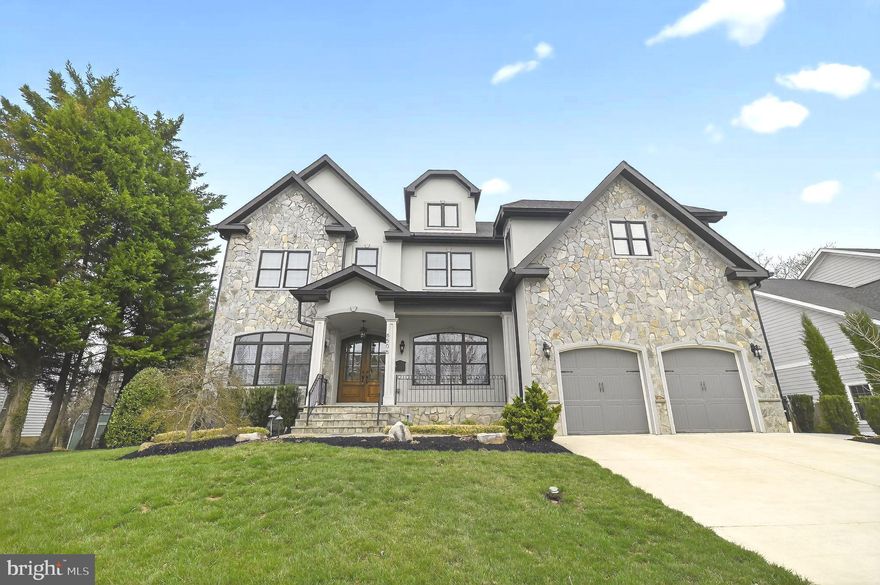 Rare Opportunity! Presenting an exquisite French Transitional residence where extraordinary craftsmanship and understated luxury define every detail. Located in the sought-after Chesterbrook Gardens neighborhood, 6506 Chesterfield Ave is an exceptional custom home offering seven bedrooms, seven full and two half baths, and over 7,200 square feet of thoughtfully designed living space across four beautifully finished levels.

From the moment you enter, the home reveals a seamless balance of sophistication and comfort. Solid hardwood floors extend throughout the main and upper levels, while abundant natural light fills the open and elegant floor plan. The main level is designed for both refined entertaining and everyday living, featuring a gracious living room, formal dining room, powder room, and a versatile private office or guest suite with a full bath.

At the heart of the home, the chef’s kitchen showcases a professional-grade Thermador appliance suite, including two dishwashers, a six-burner gas range with pot filler, wall ovens, and a refrigerator. A generous beautiful island anchors the space and is complemented by a walk-in pantry and a butler’s pantry with a beverage refrigerator. The kitchen flows seamlessly into a light-filled breakfast area and an expansive family room with coffered ceilings and a gas fireplace, while glass doors open to the rear deck, creating effortless indoor-outdoor living. A mudroom with built-in cubbies and a secondary laundry area adds everyday convenience.

The upper-level features four spacious bedrooms, each with its own ensuite bath. The luxurious primary suite serves as a private retreat, complete with a wet bar and beverage refrigerator, two custom walk-in closets, an additional dressing area, and a spa-inspired bath with soaking tub, glass-enclosed shower, dual vanities, and a dedicated makeup area. A large laundry room with cabinetry and sink completes this level.
The top floor offers an additional private bedroom with a full bath, ideal for guests or flexible living space.

Designed with entertaining in mind, the walkout lower level includes a guest bedroom with full bath, an expansive recreation room with half bath, a wet bar with a third beverage refrigerator, a media room or fitness space, and generous storage. The level opens directly to the outdoor patio, extending the home’s living and entertainment areas.

Additional highlights include three fireplaces, professional landscaping, custom window treatments throughout, multiple Restoration Hardware chandeliers, and a fully fenced backyard.
Ideally positioned just minutes from Washington, DC, multiple Metro stations, parks, shopping centers, and major commuter routes—and within the highly regarded Chesterbrook Elementary, Longfellow Middle, and McLean High School pyramid—this residence offers the perfect blend of architectural elegance, modern functionality, and exceptional McLean living.

All interior walls, including the garage, were freshly painted in 2026, and professional landscaping was installed in 2020. Move-in ready. Don’t miss the opportunity to tour this stunning home!