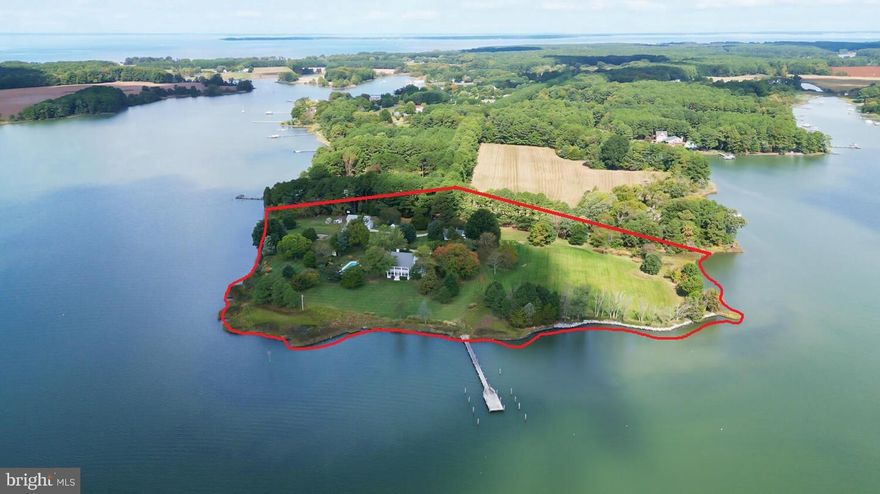 Steeped in history, Pot Pie Farm is located on a  magnificent wide point of land with panoramic views over Harris and Cummings Creeks bringing the sunrise and sunset  into your house everyday, DEEP WATER dockage with  8+ feet of  MLW , and  over 1500 hundred feet of secure living shoreline define the waterfront perimeter. ( Winner of  Wetland Wise award ). A fabulous family compound with three  separate dwellings and all are outside the flood zone and in  zone X.-   MAIN HOUSE- 6,277 square feet - Circa 1915 and thoroughly renovated in 2006 under the guidance of Architect, Christine Dayton  and expert craftsmen Ebby duPont and Jay Brown ,to include modern first floor primary bedroom suite, fabulous kitchen and long entry hall connecting rooms gently and incorporating  natural light.  There are multiple screened porches radiating from the main house and with five bedrooms, three and one half baths there is room for everyone.   GUESTHOUSE-BARN-  one bedroom , one and a half baths designed by Architect, Christine Dayton and newly constructed in 2016 provides a fabulous kitchen / gathering room overlooking Cummings Creek  and adjoins the   barn/office/storage/recreation space.     CARETAKER COTTAGE- One bedroom and one bath with detached garage and storage, built in 1920  and sited near the entrance of property with equally lovely water views.  The beautiful and generously sized salt water pool , 60x20 and 3-8 feet depth was recently renovated and  is perfectly sited between the main house and Guest house/ barn. Choice plantings frame the pool area to enjoy the sun or shade and thoroughly captivating views. The property has operated under organic farm practices resulting in beautiful healthy garden beds ,specimen trees, thriving vegetable and berry gardens and wonderful wide open fields. The field of dreams awaits . Please be sure to click the aerial video link, floor plans for each dwelling and property survey.