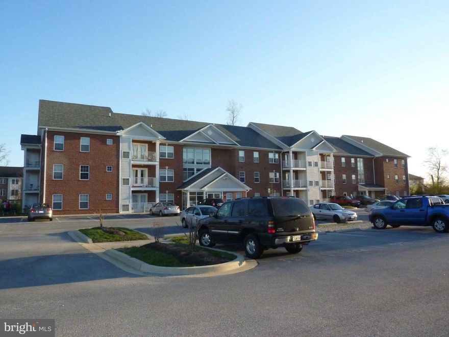 One Level Carefree Living in the heart of La Plata with Elevators.  Just a short walk to Restaurants and Shops.  Sit on your balcony and listen to the Friday Night concerts at the Town Hall in the Summer Months.  Walk Two Blocks to see your favorite team at the Greene Turtle Sports Bar.  Open Space floorplan.  Move In Ready.  New Floor coverings throughout.  Close to Schools and Shopping. Secure building with electronic access