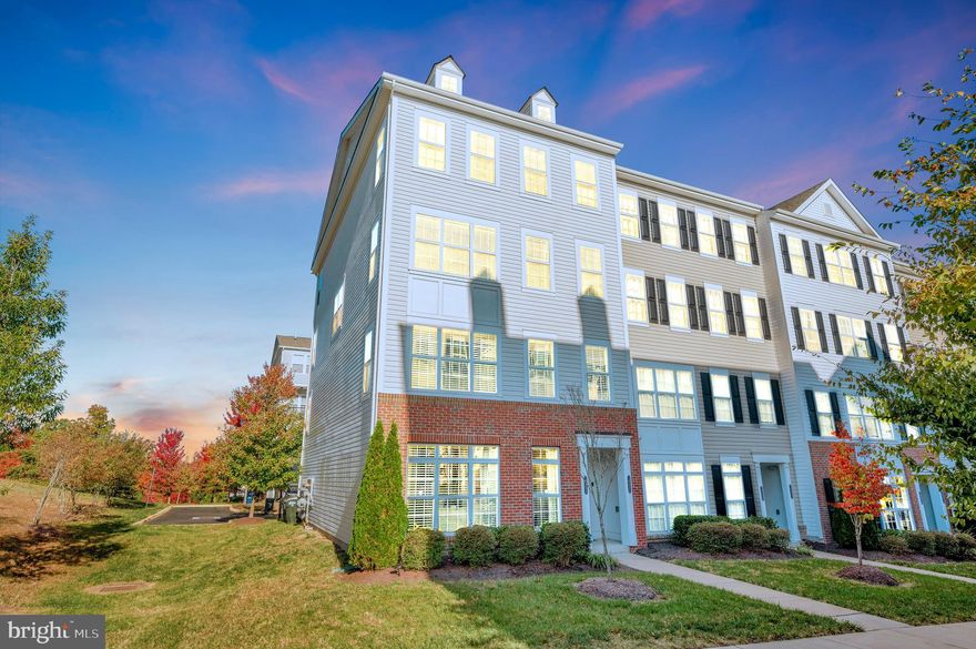 A charming 3-bedroom, 2.5-bathroom end unit condo nestled in the heart of Dumfries, Virginia. Built in 2016, this spacious 2,398 sq ft home offers modern living with a touch of elegance. Located on the upper floors this home has it all. This end unit is filled with natural sunlight with an open floor plan. The gourmet kitchen boast an extra large center island for the aspiring foodie or chef. There are cabinets everywhere, there is no shortage of storage. Off the kitchen is another living room/family with a large TV that is included in the sale of this home. Off the kitchen is a deck perfect for grilling or relaxing after a long day. The primary suite and its attached primary bath are huge. You will need blackout curtains because the room is so bright!! The luxurious primary bath has a large walking shower for 2 if you'd like..Wink, Wink... Dual Vanities makes sharing a breeze. This home checks all the boxes.  This home is also available for private showings. I would love to show you this home. Call me for a private showing.