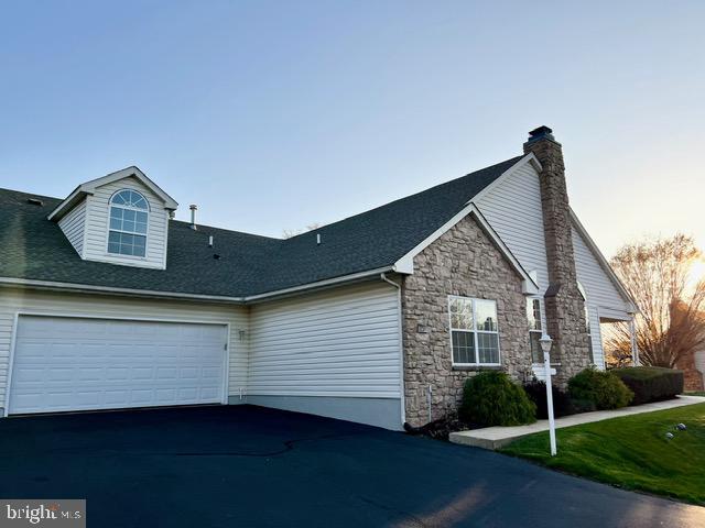 This meticulously maintained townhouse is pristine and move-in ready. Recently updated with fresh paint and brand-new carpeting throughout, this home is located in the highly sought-after 55+ community of Lionsgate. Residents enjoy a wealth of amenities, including a swimming pool, tennis/pickleball courts, a fitness center, and a clubhouse. Upon arrival, choose between entering through the front door or pulling your car into the oversized attached two-car garage, where you can access a private entry leading directly to the laundry room and kitchen. The kitchen boasts generous counter space and cabinetry, flowing effortlessly into the bright and inviting living area. The great room features vaulted ceilings, expansive windows, and a cozy gas fireplace. Glass sliders open to a private front patio, providing an ideal space for outdoor relaxation. Glass French doors lead to a den perfect for a study/office or an additional living room.
The spacious primary bedroom offers a tranquil retreat with an en-suite bathroom including glass shower and a large walk-in closet. The second bedroom includes its own private bath with a tub-shower combo, ensuring comfort and convenience for guests. Upstairs, a versatile loft space awaits, perfect as a bedroom, home office, or crafting room. The loft closet offers even more storage and the potential to be easily converted into a half bath. The low maintenance exterior includes newer roof (2021) and gutter heaters. This home is ideal for anyone seeking an affordable, well-maintained residence in a vibrant active adult community.