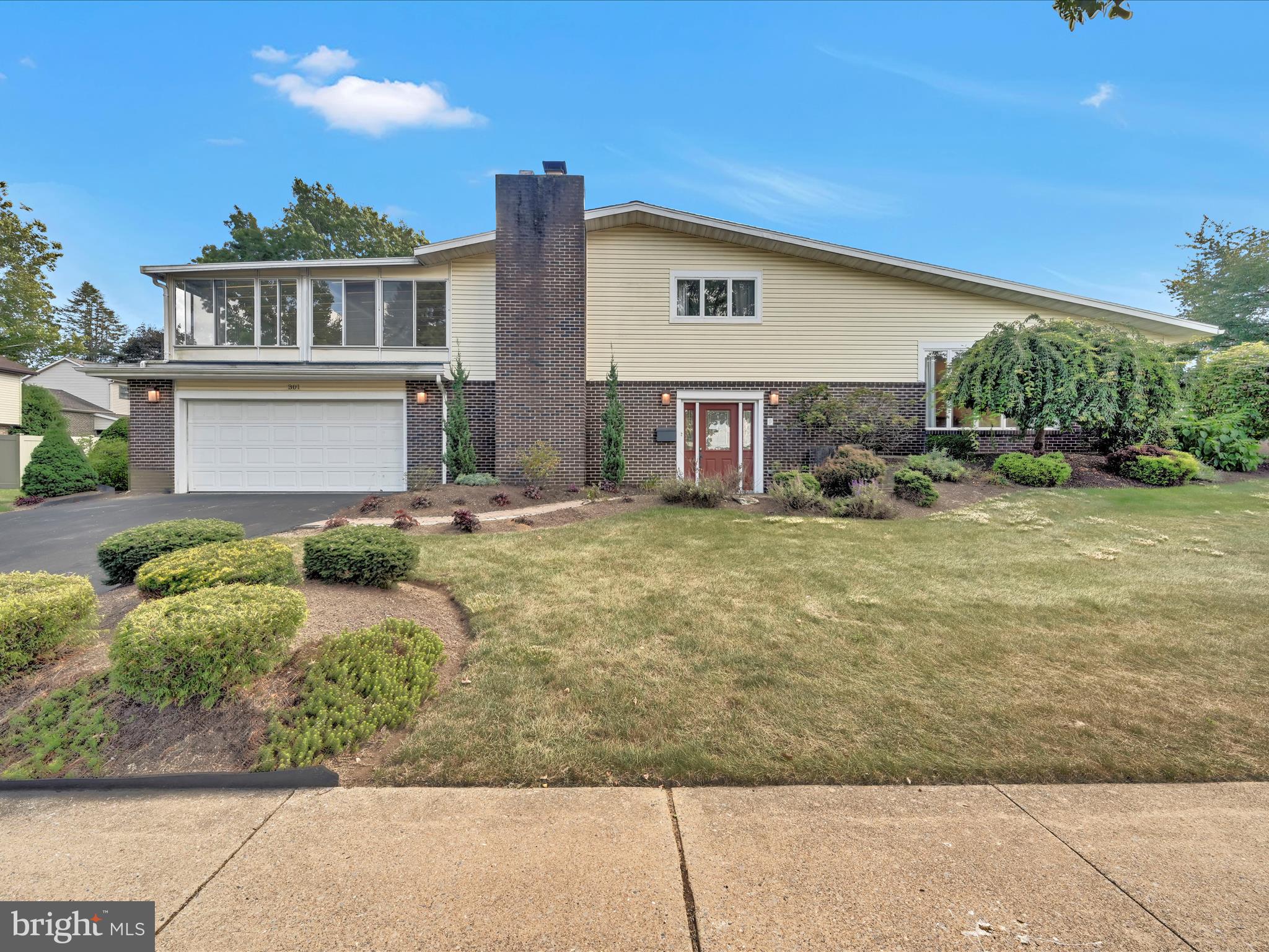 Welcome Home to this spacious split level home located on a prime corner lot in the highly sought after Wyomissing School District. Enter into the
main level living rm with wood burning fireplace, laundry rm, half bath, and access to the front entry 2 car garage. Step up to the open concept
living and dining room with vaulted ceiling. Bonus: the beautiful Samick baby grand piano will stay for the new owners. Enjoy cooking and
entertaining in the cheery, updated kitchen with pantry and an island for extra seating. Step up to the owner's suite with full updated bath, and 2
additional bedrooms featuring carpets, and closets. There's an additional updated full bath on this level. The generous sized 3 season room is sure to
please allowing for an abundance of natural light as you gather for family activities and entertainment. The lower level family rm offers a custom
bar, walk-in closet, and newer updated full bath with tile shower. Present owners occasionally used this space as a 4th bedroom for overnight
guests. Over 2,860 sq ft of finished living space plus the enclosed 20' x 25' three season room, gives this home a blend of space and functionality.
From the main level, sliders lead to the enclosed back yard offering a classic white vinyl fence and covered patio providing both privacy and
security for your family's outdoor recreation. Ideally located in the desirable Wellington Downes neighborhood within the Wyomissing Borough,
near shopping, dining, medical, and easy access to major routes. With the current market demand, act quickly and set up your showing today!