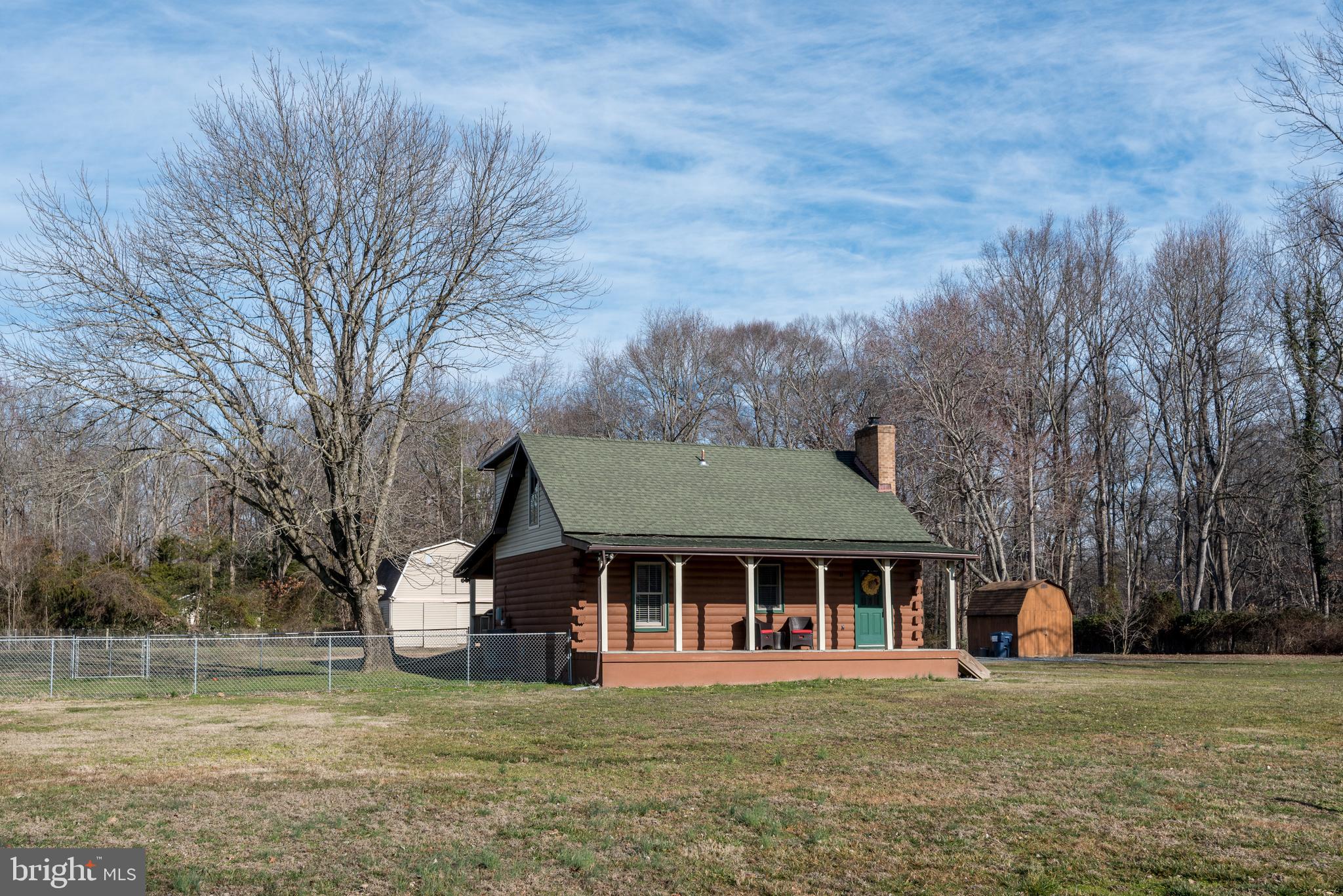Adorable, exceptionally well maintained log cabin cape cod with newer appliances and systems, and new propane fireplace! Back yard was former pasture and remains perfect setting for that, with a big beautiful barn. Choose your front or back porch to sit and relax, with easy gate access to the fenced area in the yard. Unpack and relax goes fast, this is one to watch!