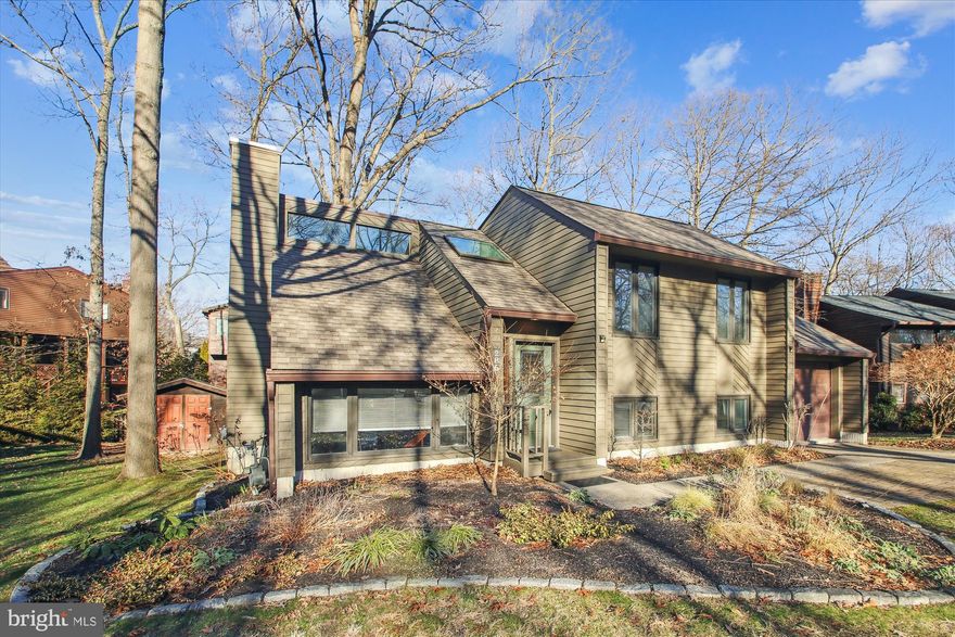 Beautiful, light-filled, contemporary two-level home on a quiet cul-de-sac in sought-after Stewart's Landing on the Magothy River!  Open concept, eat-in kitchen with cathedral ceilings, renovated in 2016 has abundant beautiful cabinetry, Corian countertops, and stainless-steel appliances!  Sliding glass doors lead to large composite deck for dining and enjoying your beautifully landscaped outdoor living space.  Natural gas fireplace enhances large living/family room adding a touch of warmth and comfort, making it perfect for relaxing evenings at home or entertaining guests!  Sliding doors from this room lead to large outdoor patio.  Main level includes primary bedroom with private bathroom access and sliding doors leading to main level outdoor deck, as well as large 2nd bedroom.  Lower level includes additional bedroom, full bathroom, laundry/storage room, and garage access.   Plenty of additional storage available in large outdoor shed, and garage.   This water privileged community, with marina and boat ramp, offers access to the Magothy River, the Chesapeake Bay and beyond for all water enthusiasts!  Other community amenities include a dog park, playground with basketball court, kayak rack, and walking paths, offering many outdoor activities for residents to enjoy, as well as many neighborhood social events and gatherings.  This home is conveniently located to all major commuter routes to Baltimore, Annapolis, Ft. Meade, DC, and Columbia.  Welcome Home!