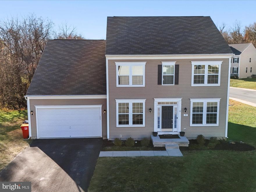 Come home to Spruce Hill North & enjoy one of the best lots in the neighborhood. This corner lot does not have neighbors close on either side and backs to woods for added privacy. The heart of this home is the kitchen with modern white cabinets & black handles. You'll also appreciate the stainless steel appliances & added storage at the butler's pantry.  All windows have custom white window blinds. The light fixtures have been upgraded on the top 2 floors. The laundry is conveniently located on the bedroom level. The finished basement with full bath is a great place to unwind or entertain. This neighborhood is very convenient to shopping, dining, historic downtown Charles Town, Harpers Ferry & the MARC train.