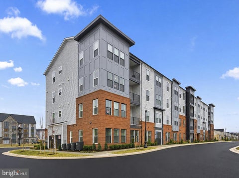 Photo of 23688 Bolton Crescent Terrace #304, ASHBURN, VA 20148 (MLS # VALO2134594)