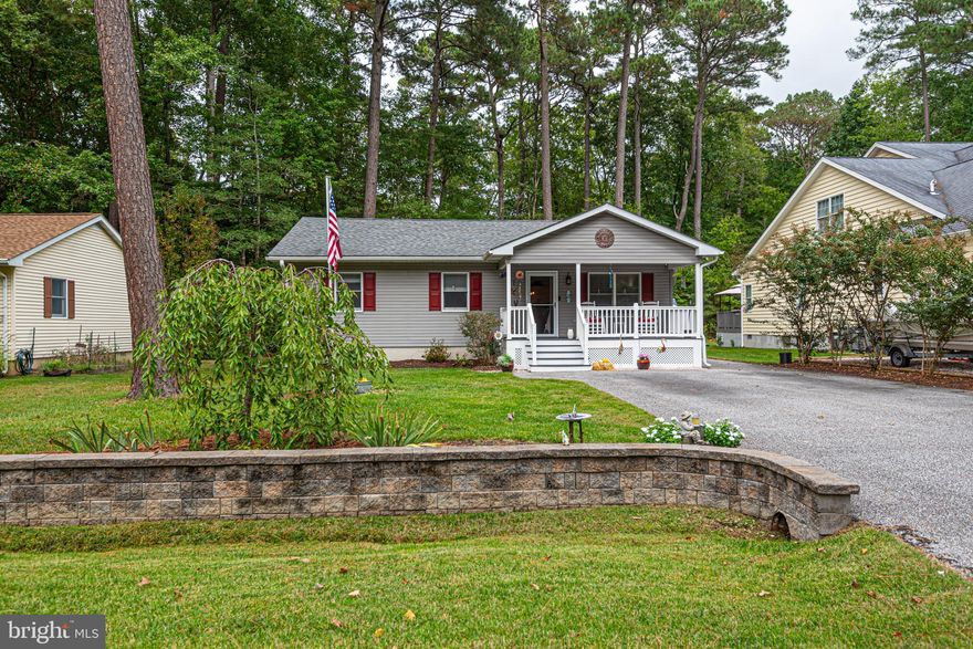 Spacious, very well-maintained rancher on an oversized, cleared lot in desirable Ocean Pines!  3 bedrooms, 2 full bathrooms plus a generous sunroom.  Eat-in country kitchen with updated cabinets and counter tops.  Large, covered “rocking chair” front porch and rear private 3 season porch leading out to a sunny deck.  Ample storage, pull down attic access and large shed. Site plan shows plenty of room for adding a garage with appropriate approval and permitting.  Close to beaches and all that Ocean City has to offer.  Short distance to golf and yacht club, swimming pools and farmer’s market.