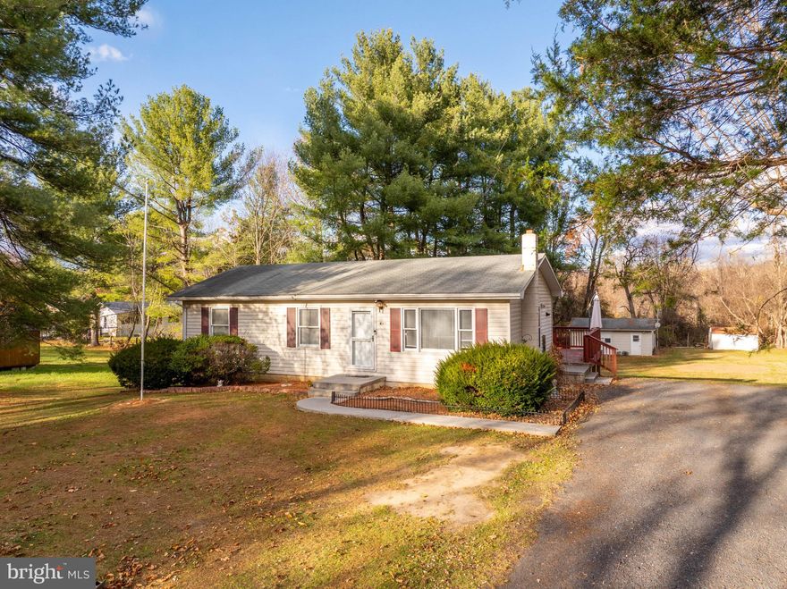 Welcome to this charming ranch-style home located in Edinburg, VA. This spacious 3 bedroom, 2 full bath home offers main-level living with a full walkout basement. The main floor features a bright and open living room with abundant natural light, a dining area, and a well-appointed kitchen with access to a large, wraparound deck — perfect for outdoor dining and entertaining.

All three bedrooms and a full bath are conveniently located on the main level. The finished basement provides an additional family room, bar/entertaining area, a full bath, laundry area, and an extra room that can be used as an office, guest space, playroom, or flex space. The basement also includes a woodstove for an additional heat source and walks out to the spacious backyard.

Outside you’ll find ample parking, plus a detached oversized 1-car garage offering great storage or workshop potential. If you’re looking for a home with plenty of space inside and out, this one is a must-see.
