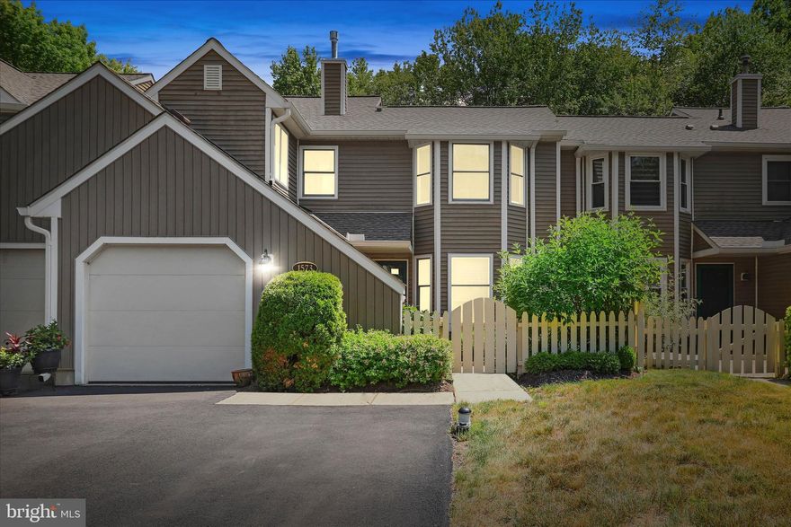 Introducing a stunning 2 bedroom, 2.5 bath home in desirable Tanglewood, located on a cul-de-sac with private fenced in backyard with no homes directly behind it.  Enjoy a blend of modern design and timeless charm.  Enter through the private gated courtyard with professionally landscaped perennial gardens.  Very open-main level floor plan with entry/foyer, sitting room, formal living/dining room featuring marble antique gas fireplace that was acquired from a 3-story brownstone in the city of Philadelphia, circa 1890-1910.  Gourmet kitchen features sleek countertops, custom wood cabinetry with glass door accents and high end appliances.  A main level half bath, laundry/mudroom area and one car garage complete the main level.  Retreat to the nice size primary bedroom with walk in closet and private ensuite bath.  A hall bath and second bedroom offers a flexibility for guests or home office.  Experience the best of suburban living!  Your dream home in Tanglewood awaits.