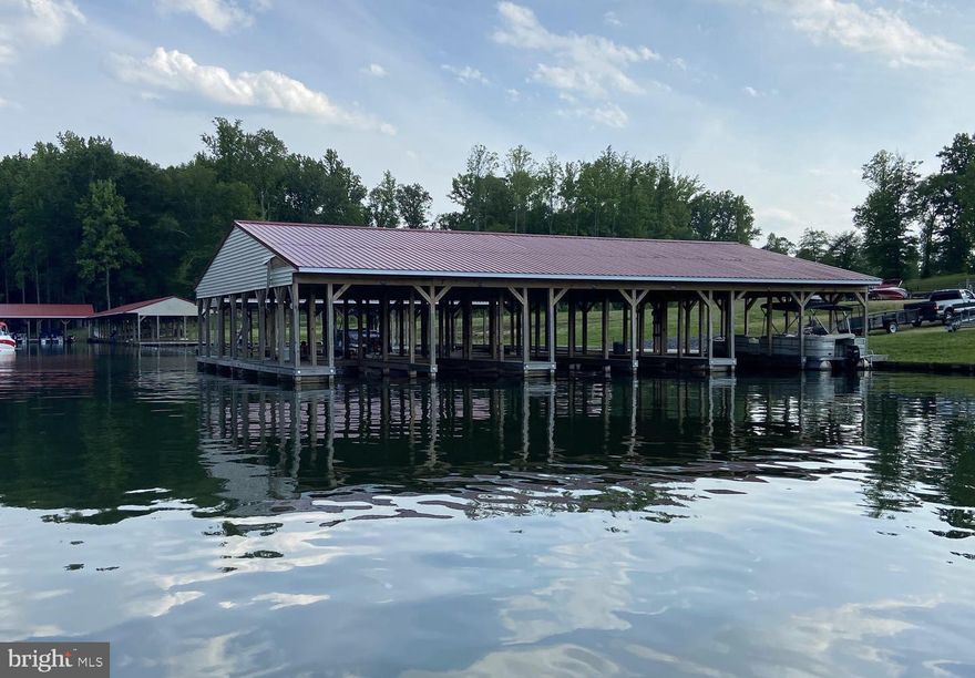 Beautiful and flat water access lot in very popular subdivision at Lake Anna with high speed internet is now available!   A perfect spot to built your lake house on the private side of Lake Anna, located within the Noah's Landing -- one of the most popular subdivisions at Lake Anna.   You will save money when you build your home here because (1) fewer trees to be removed, and (2) you won't have to pay the extra costs to install a septic drainfield on your lot; this is one of the few subdivisions at Lake Anna that has an offsite shared neighborhood drainfield, which saves you money, and gives you much more flexibility and space on your lot when you build your home!   From your lot you can walk to the water and the great neighborhood common area, where you'll find a host of fantastic amenities, including basketball courts, tennis courts, picnic gazebo, a boat launch, and more.   Covered boat slips can be purchased from the HOA!  Superb location: only about 10 minutes from groceries, local restaurants, The Lake Anna Tap House, Coffee & Cream, ABC store, vet clinic, fast food, nail salon, and more, and roughly just 45 minutes to Richmond, Charlottesville, and Fredericksburg.  Just 90 minutes south of Washington DC!