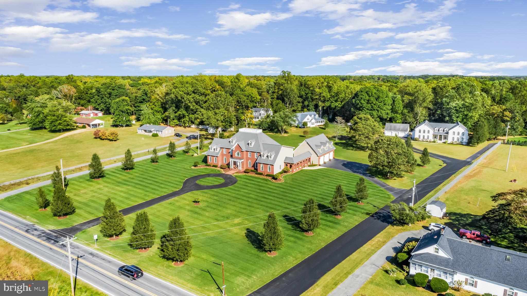 There are no words that can fully describe the level of detail and care in this property. Intentional elegance, tasteful opulence, thoughtfully efficient are just the surface of what this property has to offer and what it can be for you and or your family. This home has almost everything you can ask for in an estate. The property features a total of 10,800 finished sq feet across 7 bedrooms and 6.5 bathrooms. There is 1,294 sq feet of this footprint in an apartment that is above the garage. The tax record is incorrect as the basement and main level are approximately 5300 sq ft each. The total square feet is adjusted and reflected in the coming 3D laser scan. This puts the main home at 12,442 sq feet and total structure is 13,736 sq feet plus the remaining sq footage of the garage itself. The apartment is currently used as an income generating apartment, but could easily be the guest home or private living space for an older dependent. Please review the Features & Information sheet in the disclosures for additional information on the property. Note the photos are of true night, exterior and drone to get a full scope of the lot and property. The shingled roof was replaced last week with a new black shingle and a transferable warranty.
